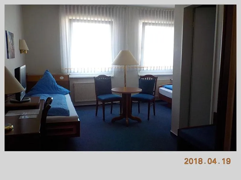 Photo of the whole room, Seating Area in Porsche Hotel