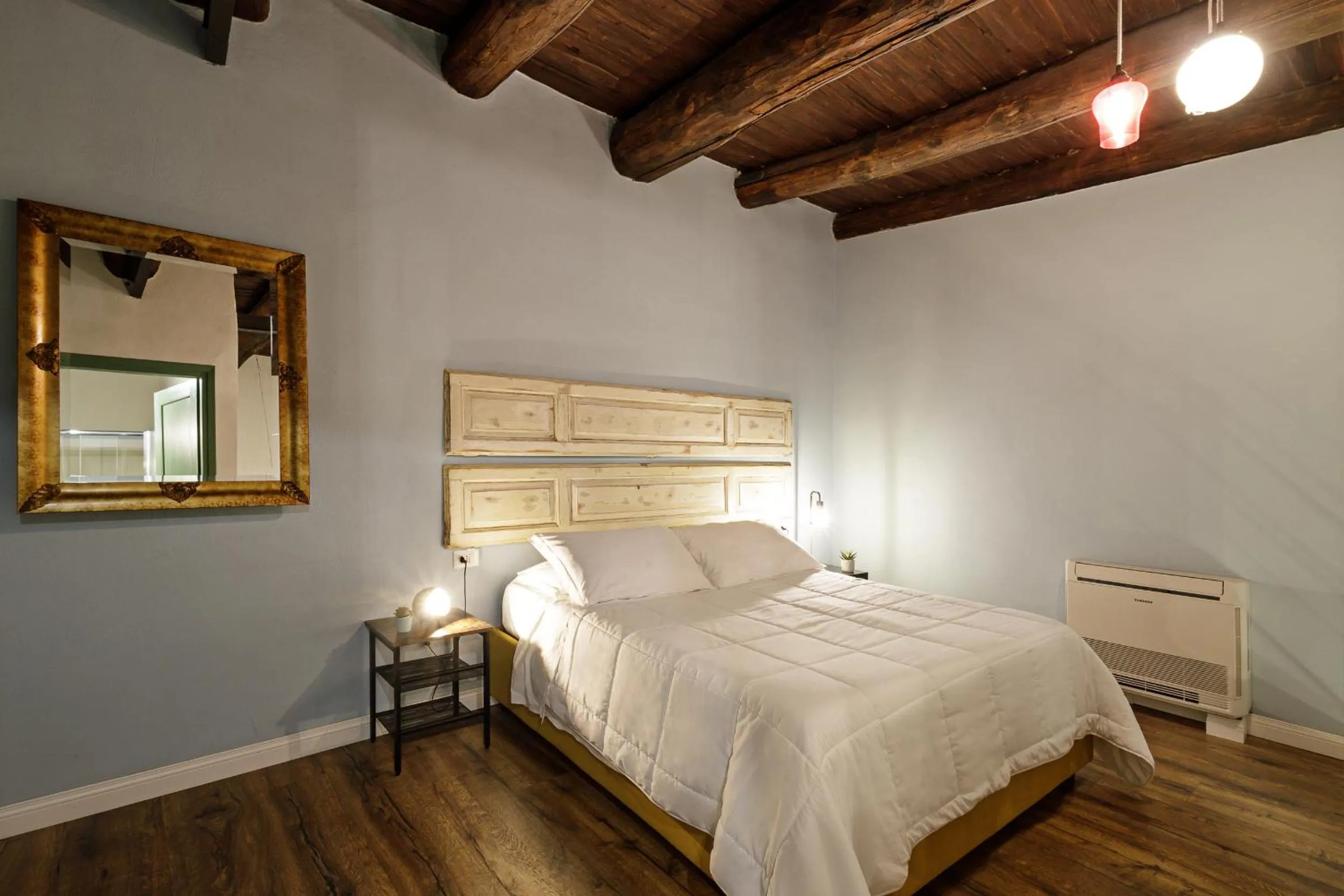 Seating area, Bed in Palà Suites