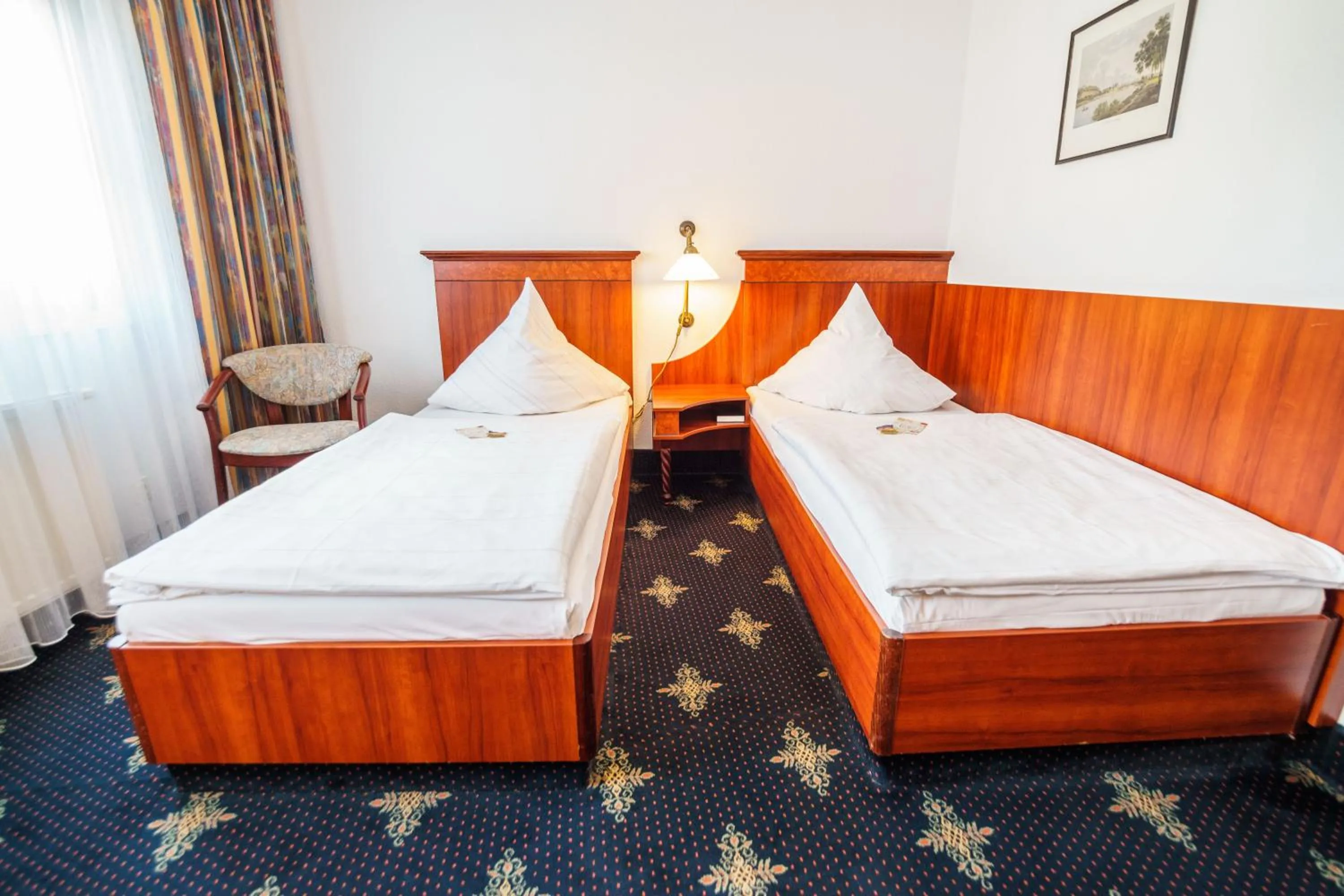 Photo of the whole room, Bed in Hotel Wilder Mann Annaberg-Buchholz