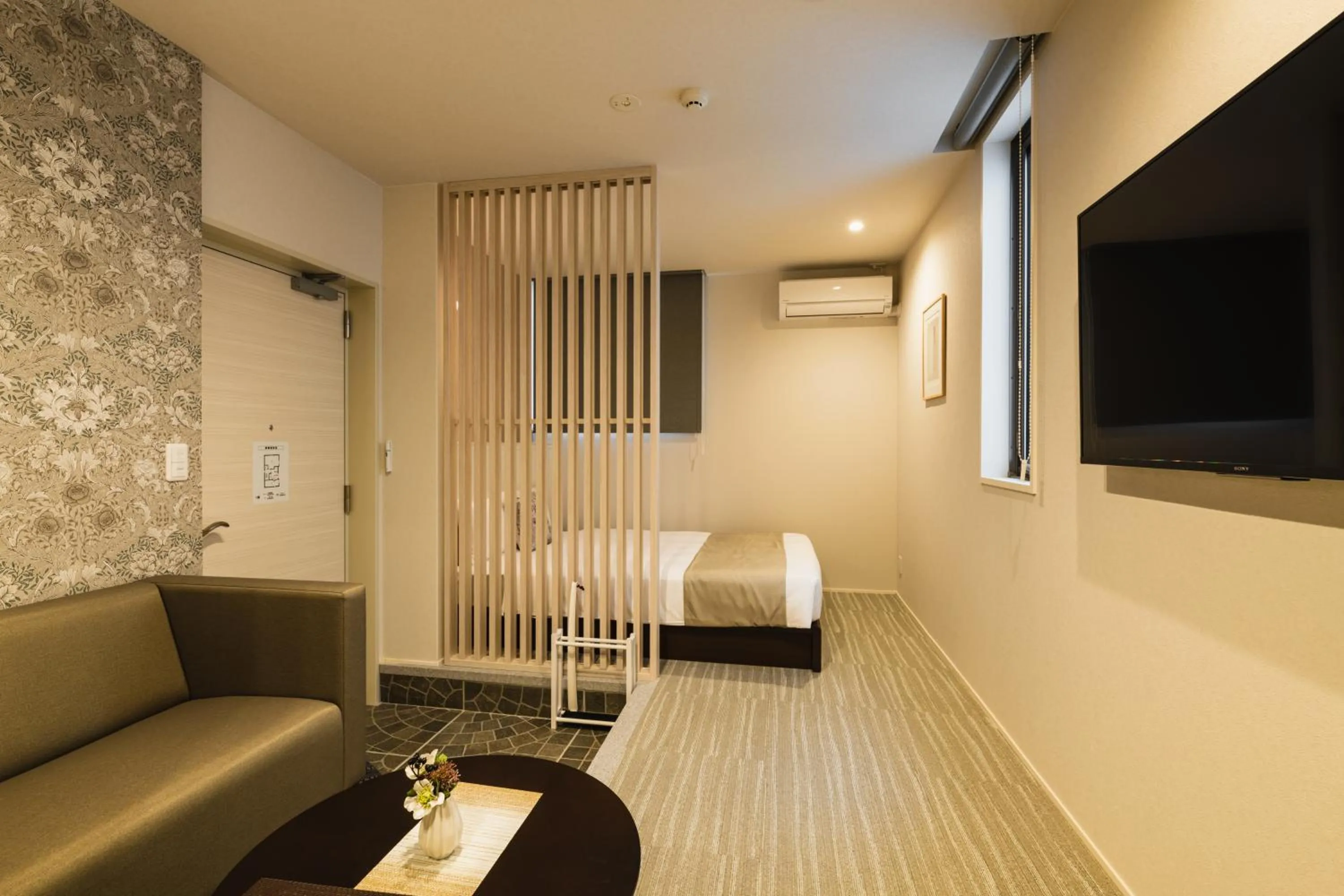 Bed in GRAND BASE Yakuin Odori