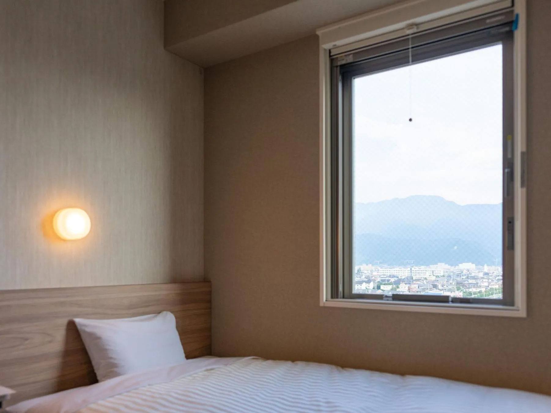 Bed in Super Hotel Iyo Saijo