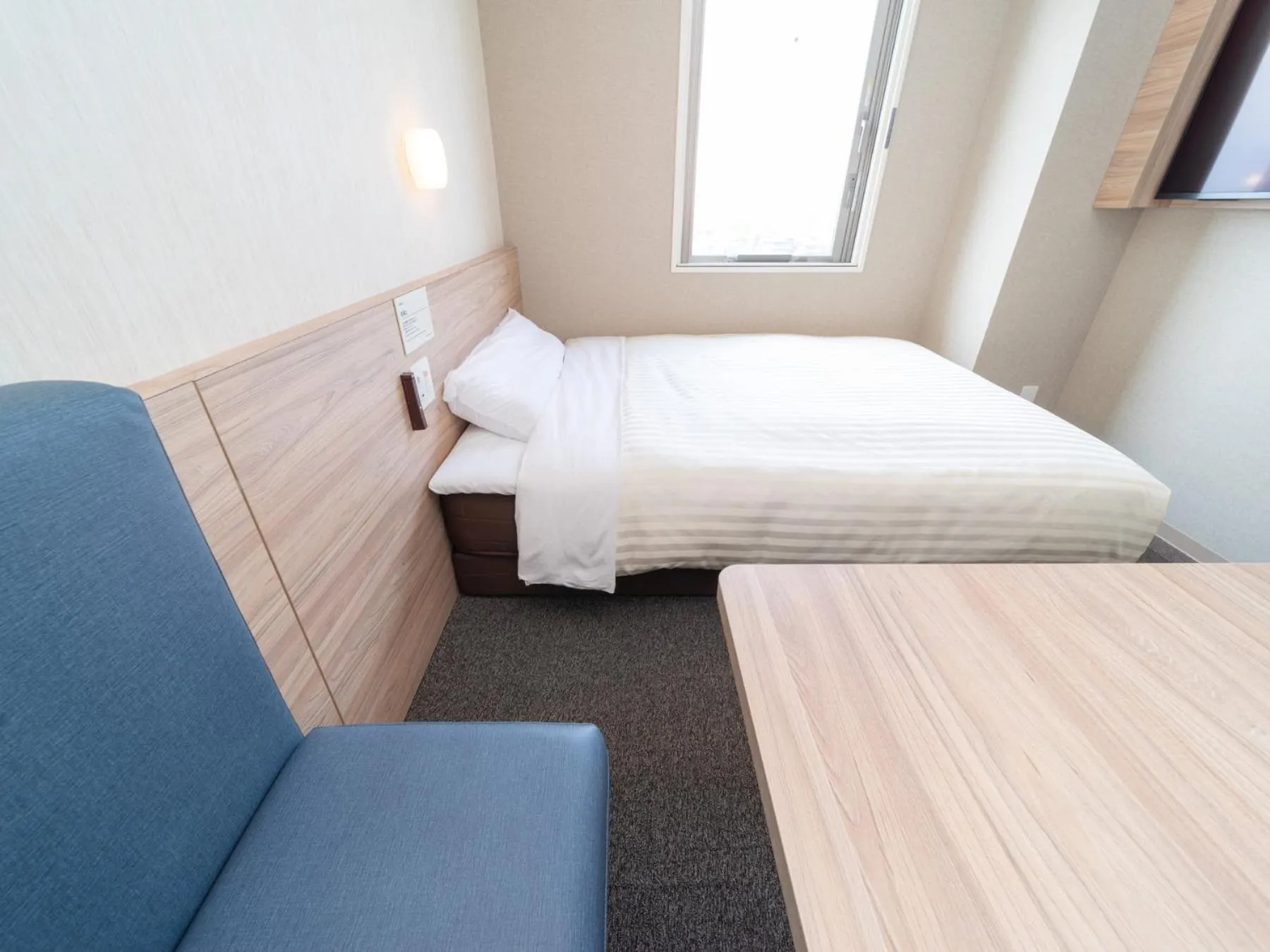 Bed in Super Hotel Iyo Saijo