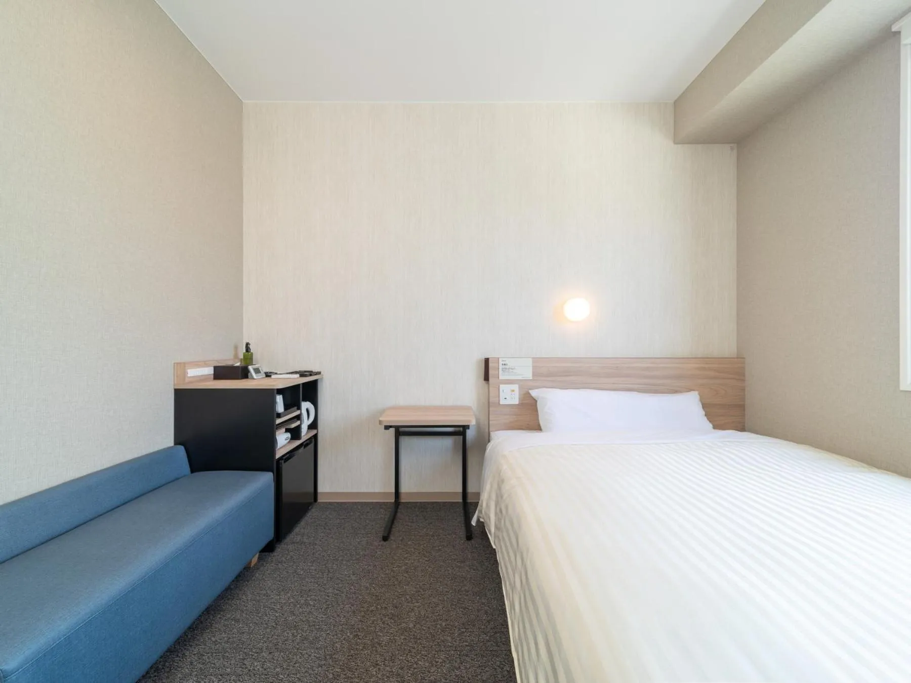 Bed in Super Hotel Iyo Saijo