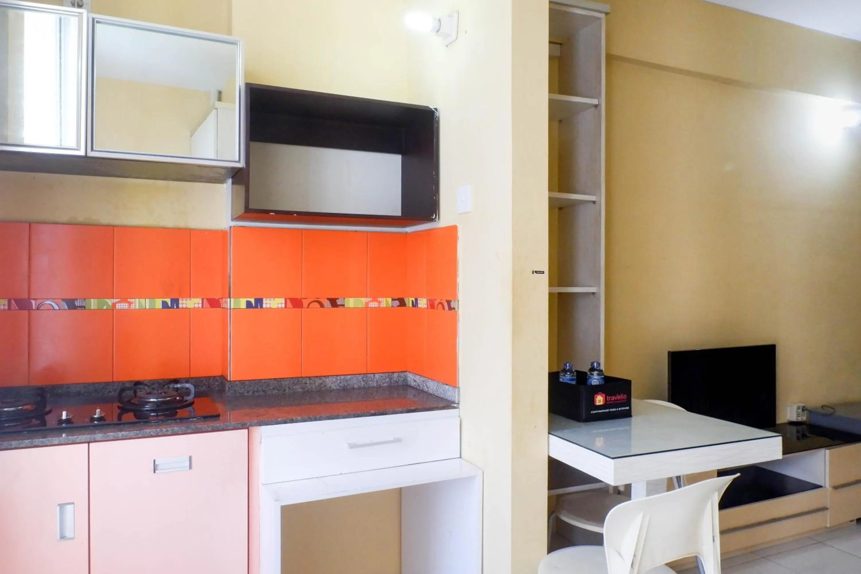 Kitchen or kitchenette in Minimalist 2BR Apartment at Dian Regency By Travelio