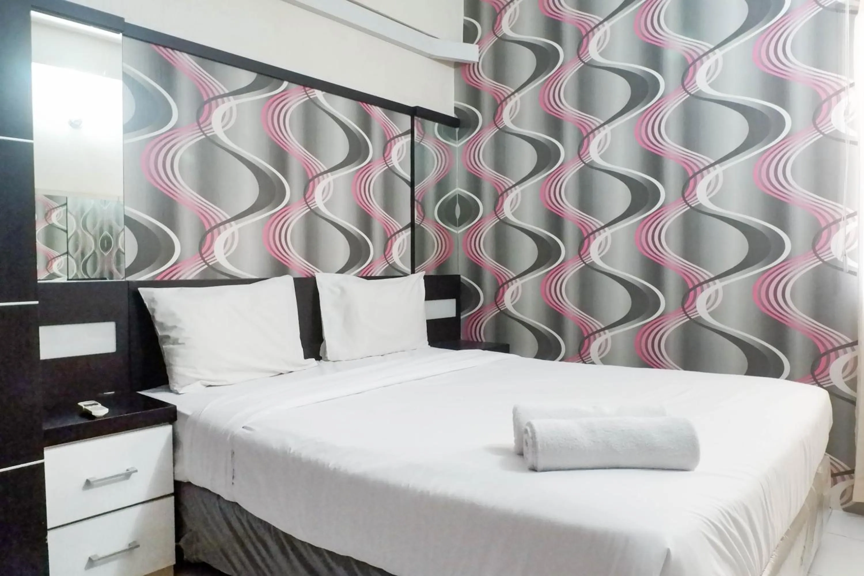 Bed in Minimalist 2BR Apartment at Dian Regency By Travelio