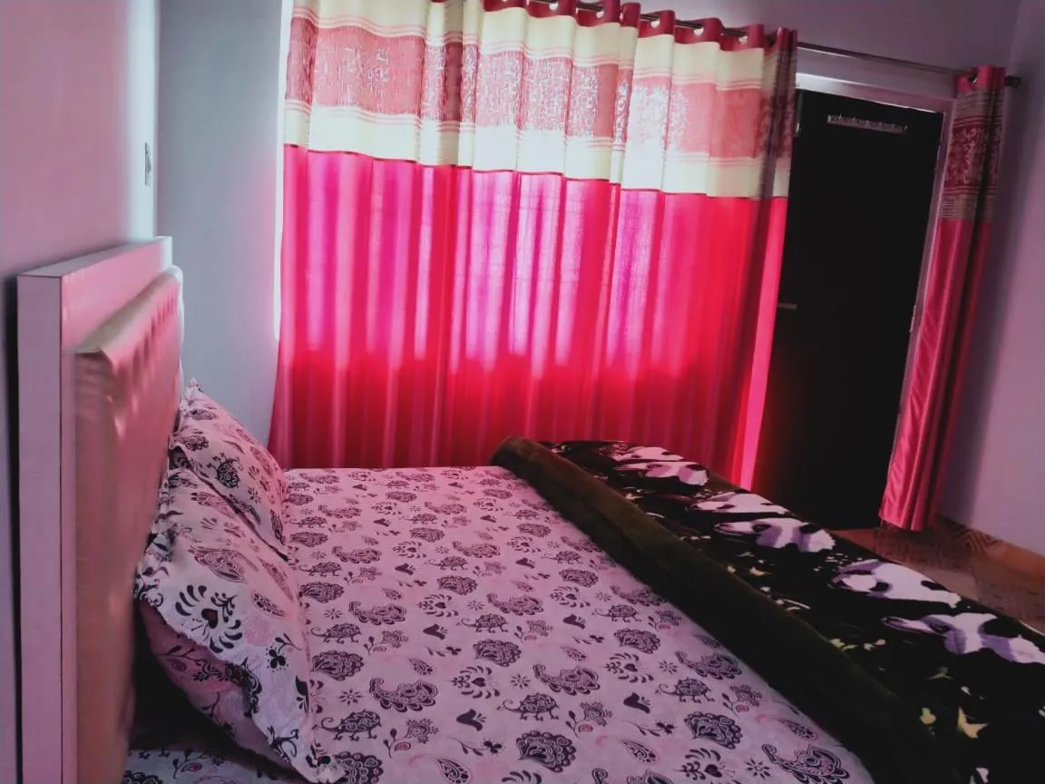 Bed in Pahadi Ghar Homestay