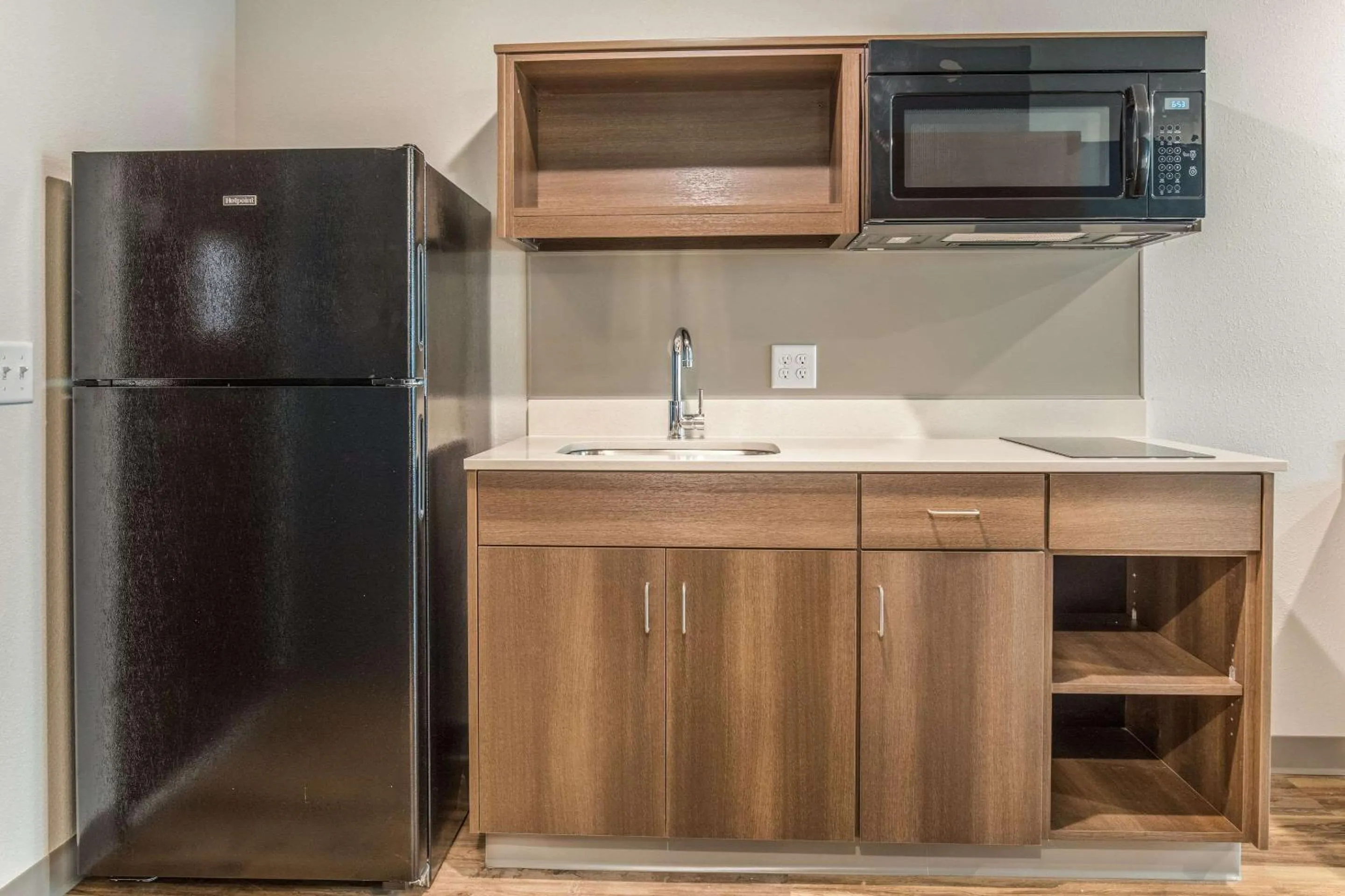 Photo of the whole room in WoodSpring Suites Greenville Haywood Mall