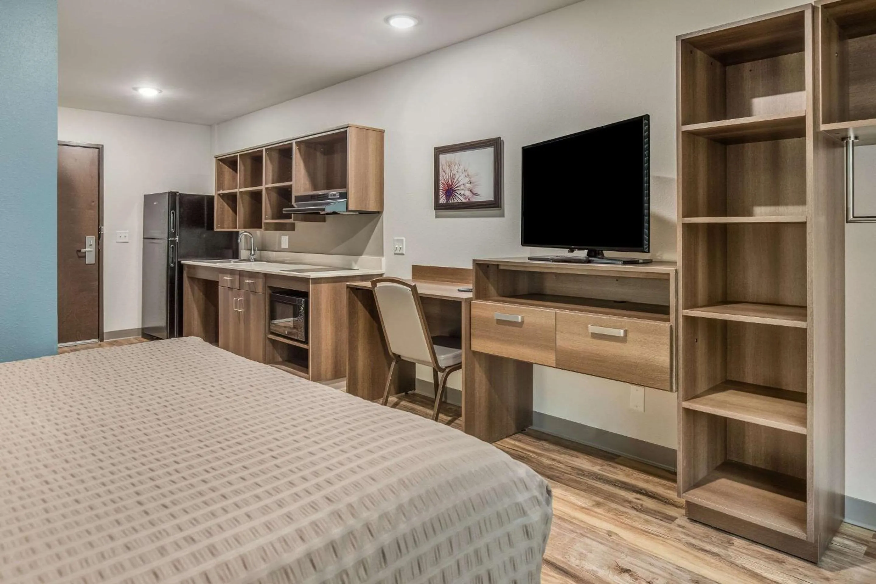 Photo of the whole room, Bed in WoodSpring Suites Greenville Haywood Mall