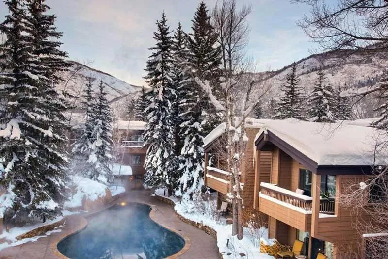 Property building in Luxury 2 Bedroom Downtown Aspen Vacation Rental With Access To A Heated Pool, Hot Tubs, Game Room And Spa