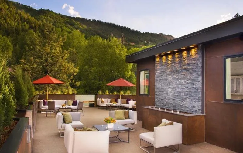 Property building in Luxury 2 Bedroom Downtown Aspen Vacation Rental With Access To A Heated Pool, Hot Tubs, Game Room And Spa