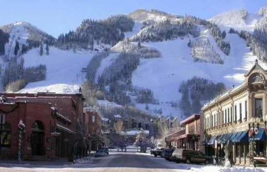 Property building in Luxury 2 Bedroom Downtown Aspen Vacation Rental With Access To A Heated Pool, Hot Tubs, Game Room And Spa