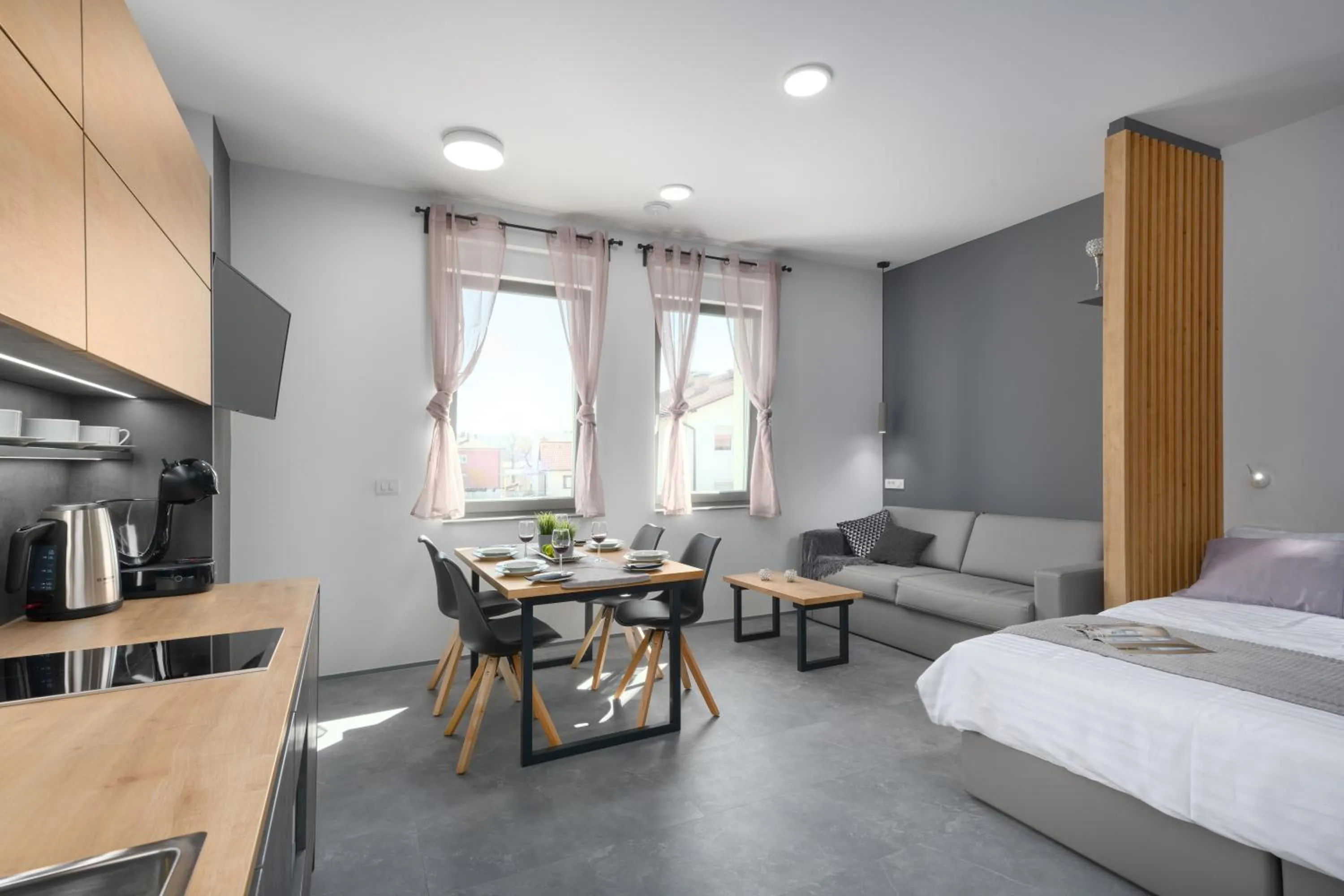 Living room, Bed in Vila Emona - Central Apartments - Free Parking