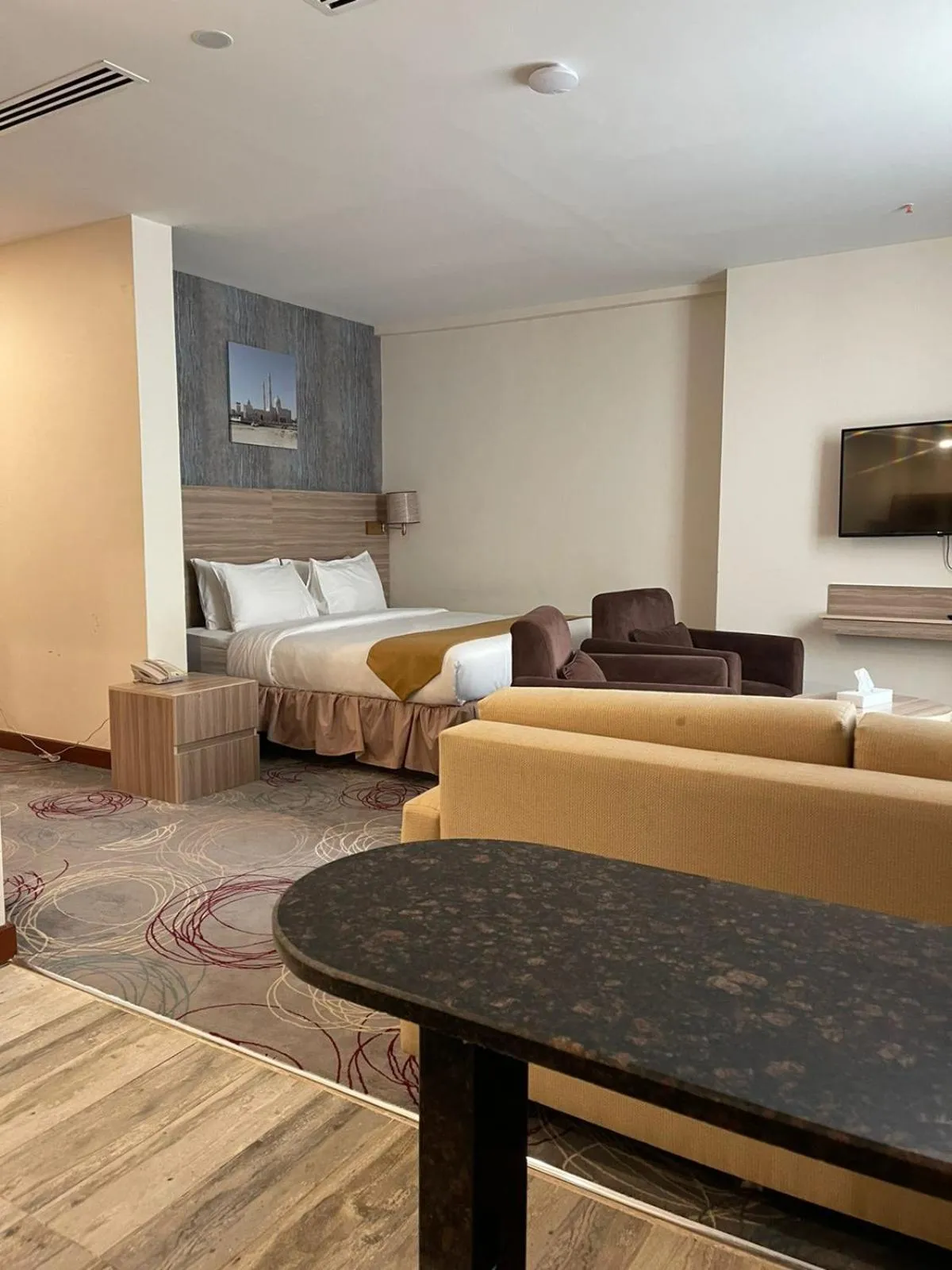 Living room, Bed in Grand Tourist Hotel