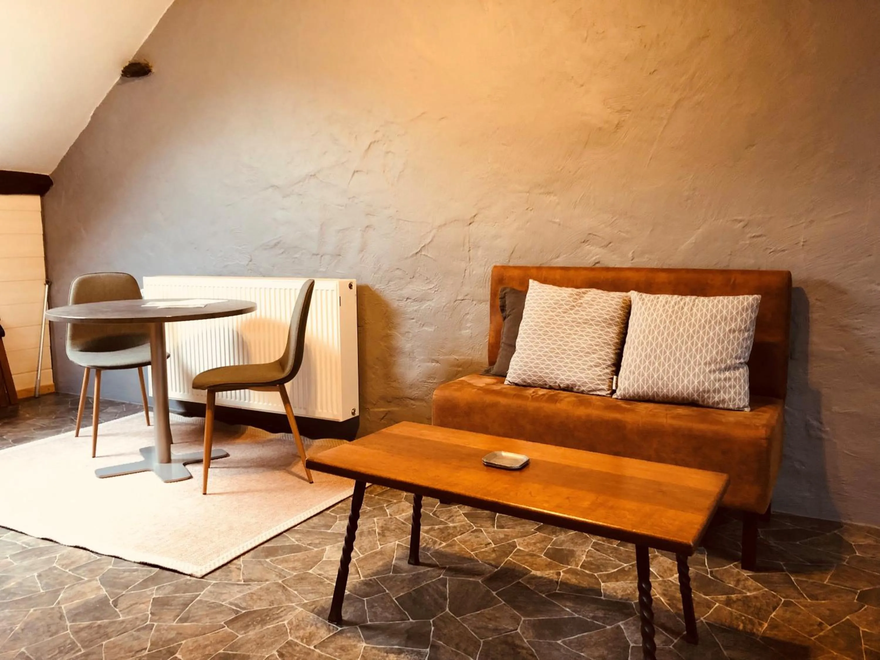 Seating area in Appart Hotel Au Pied de Vigne