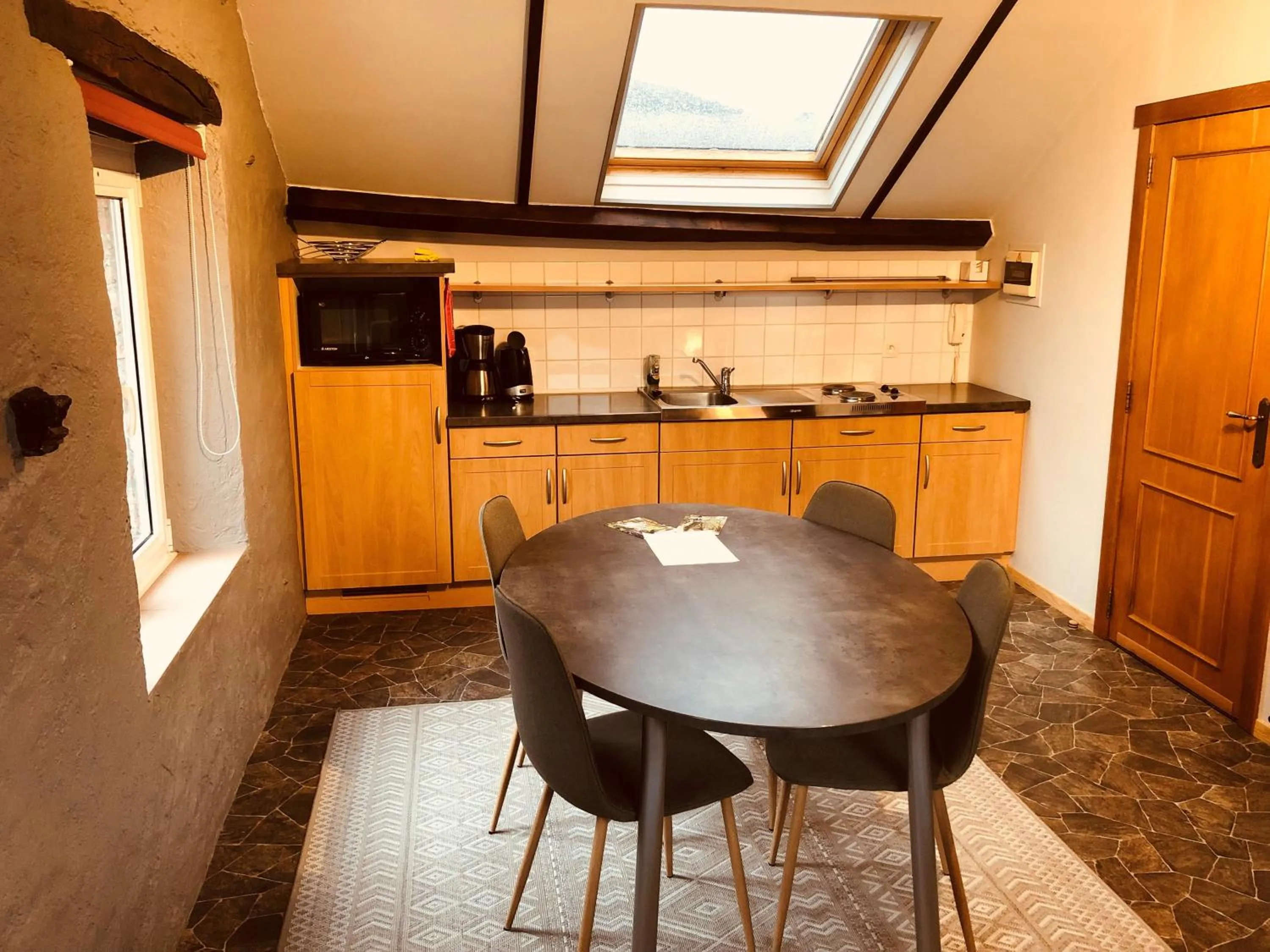 Kitchen or kitchenette in Appart Hotel Au Pied de Vigne