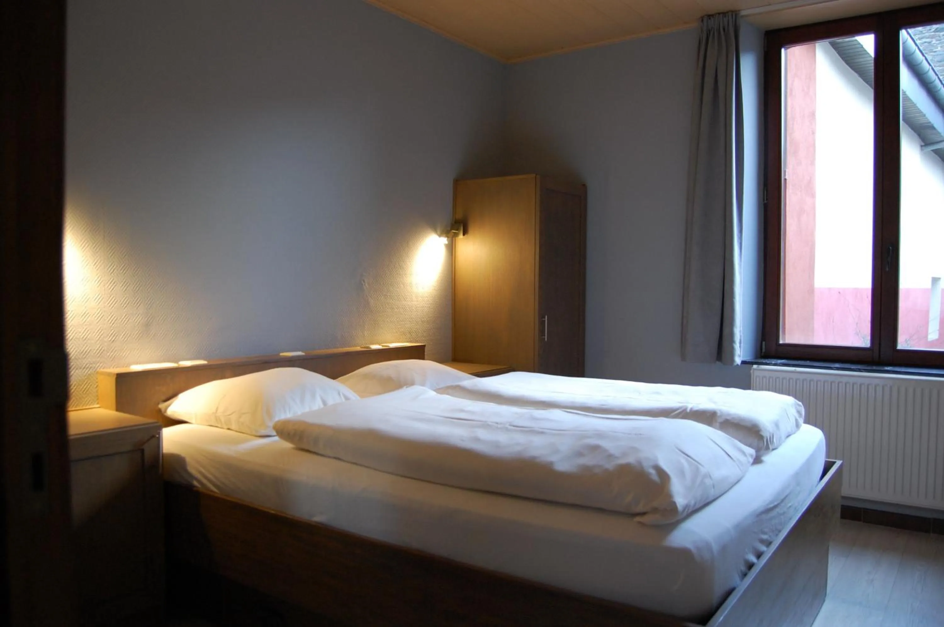 Bed in Appart Hotel Au Pied de Vigne