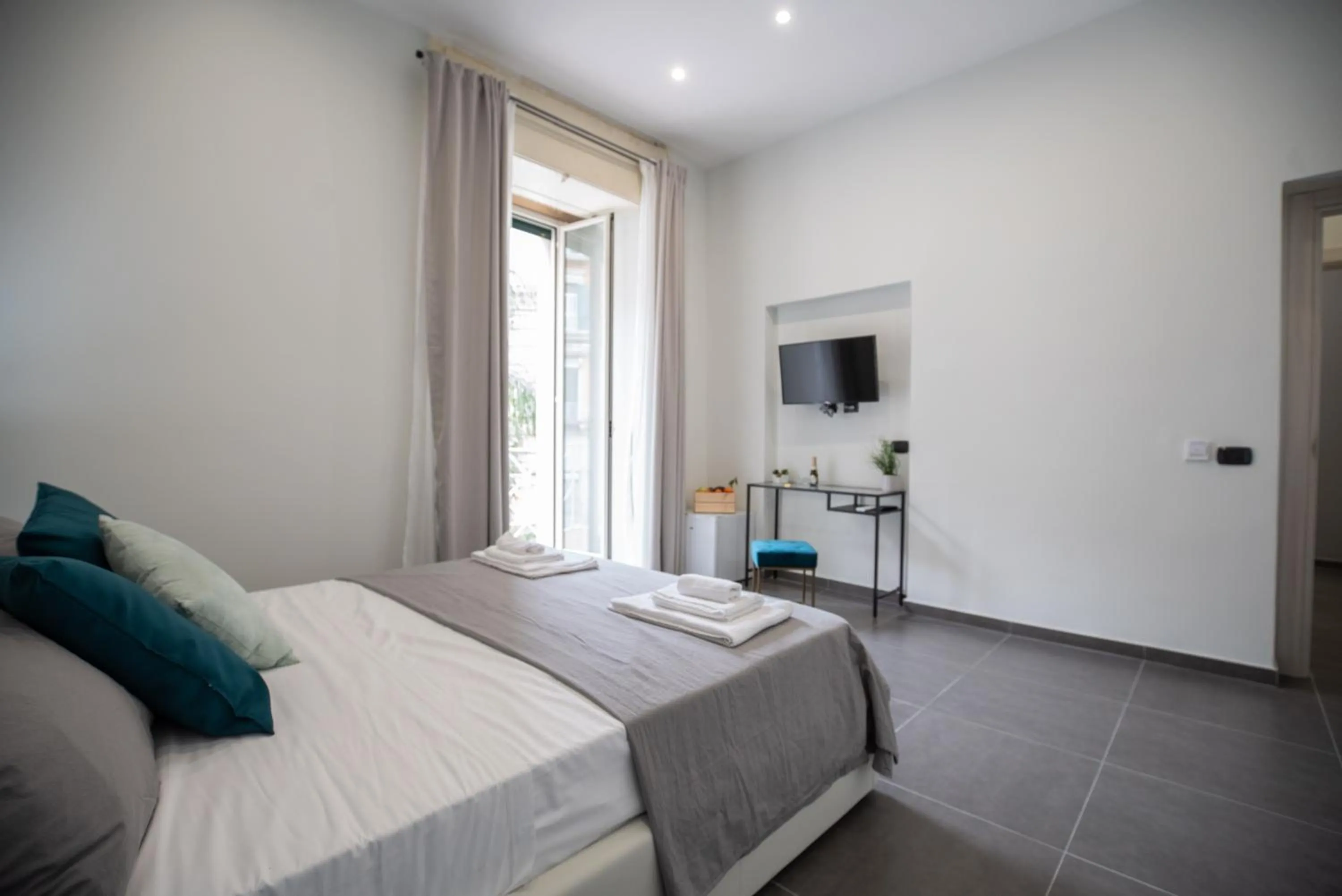 Bed in Doria Suites Napoli