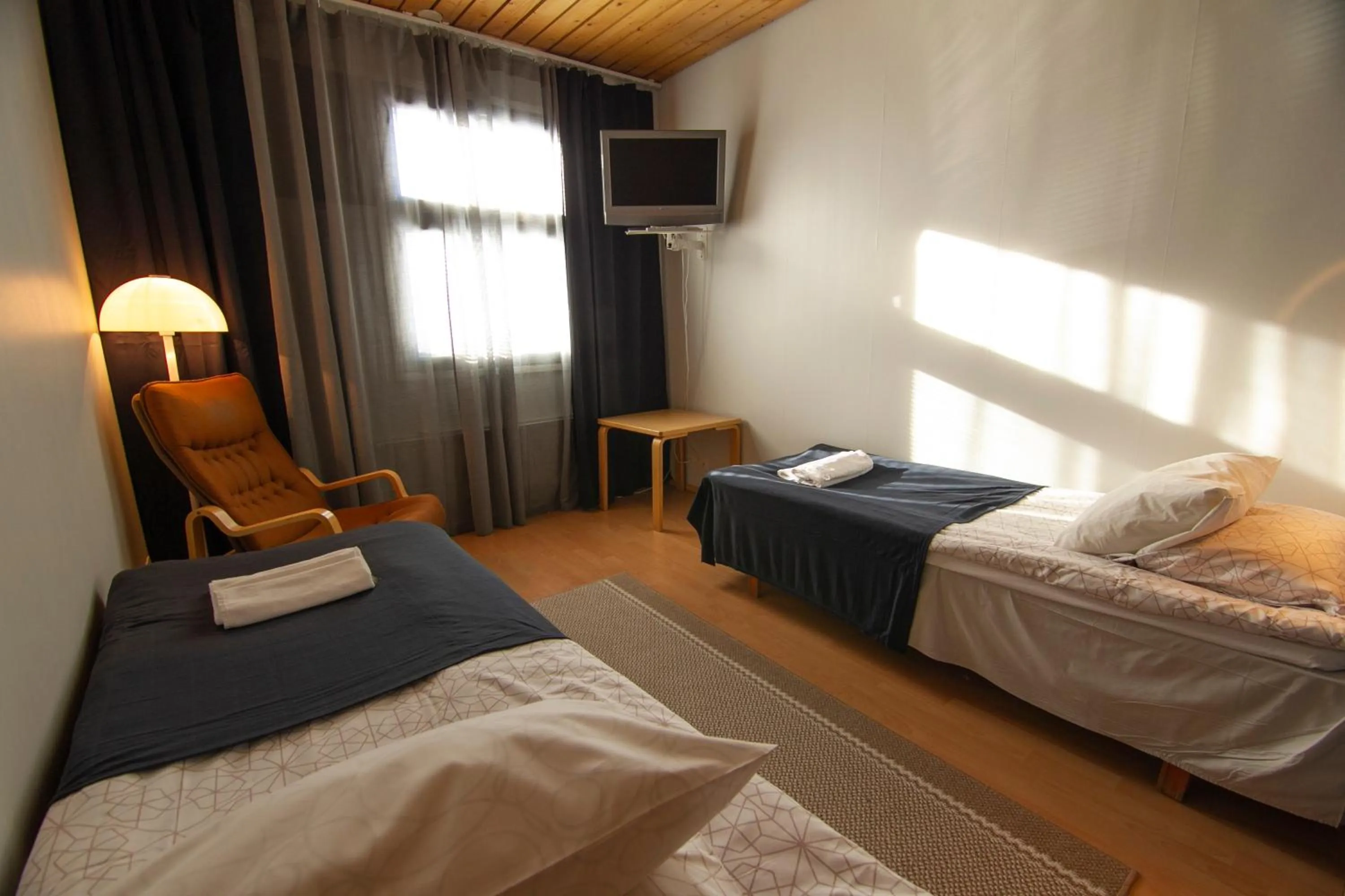 Photo of the whole room, Bed in Hotelli Peltohovi