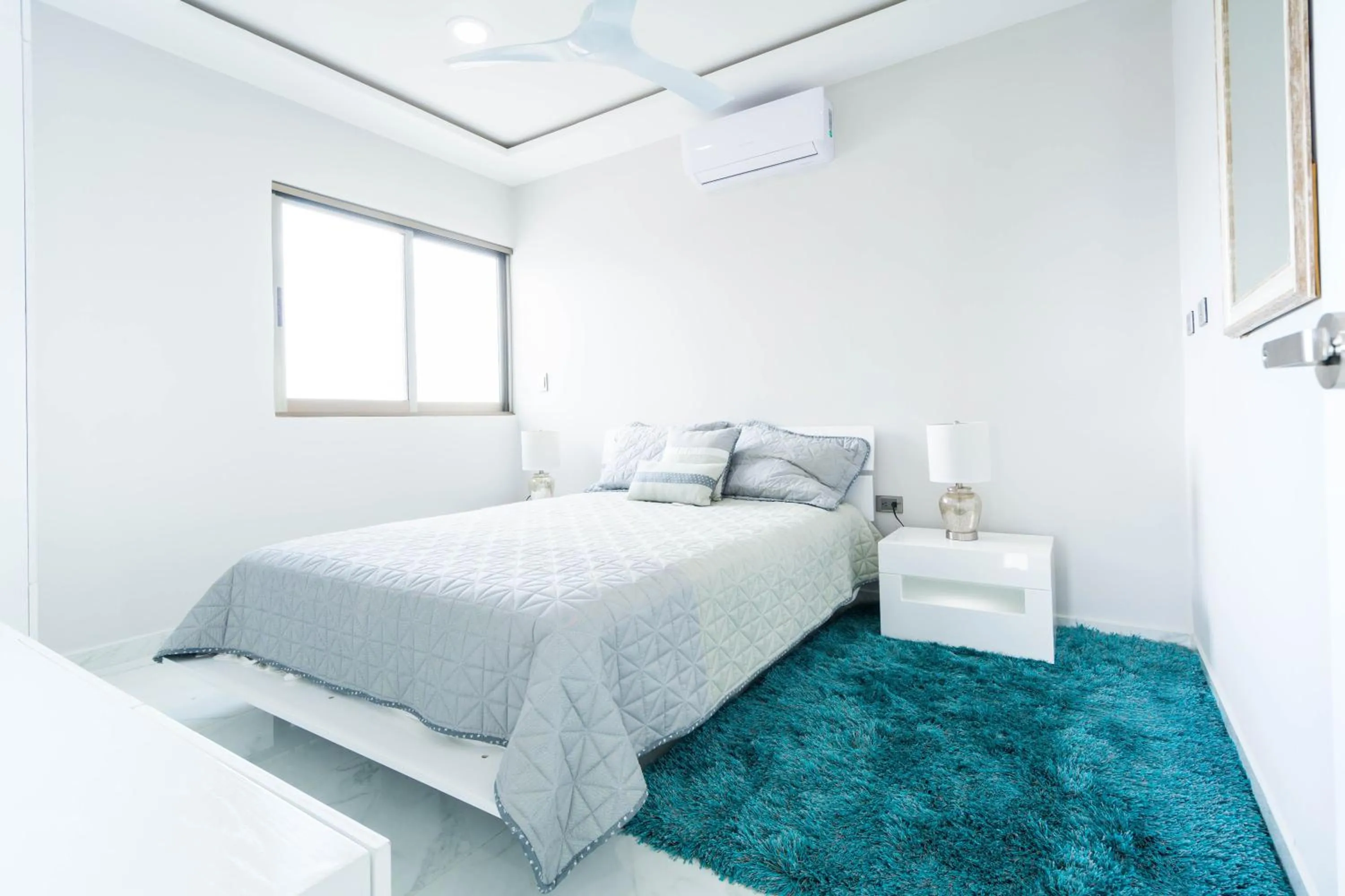 Bed in Palmarena Rooms & Residences - Long Stay Comfort with Parking, Sauna, Gym & Pool - Steps from 5th Avenue