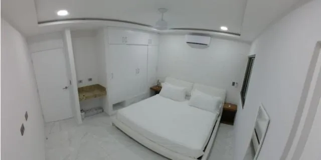 Bed in Palmarena Rooms & Residences - Long Stay Comfort with Parking, Sauna, Gym & Pool - Steps from 5th Avenue