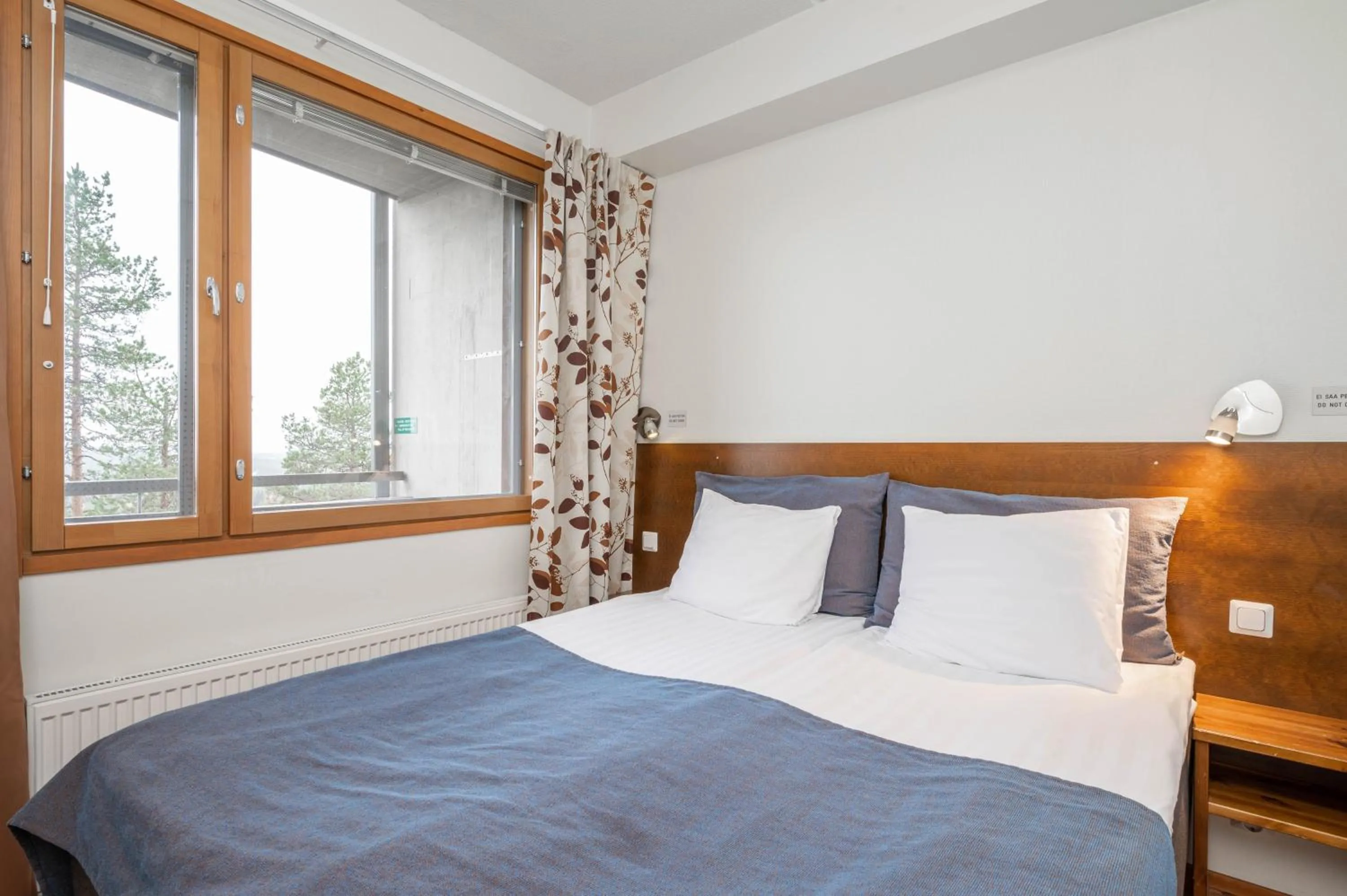 Decorative detail, Bed in Ski-Inn RukaSuites