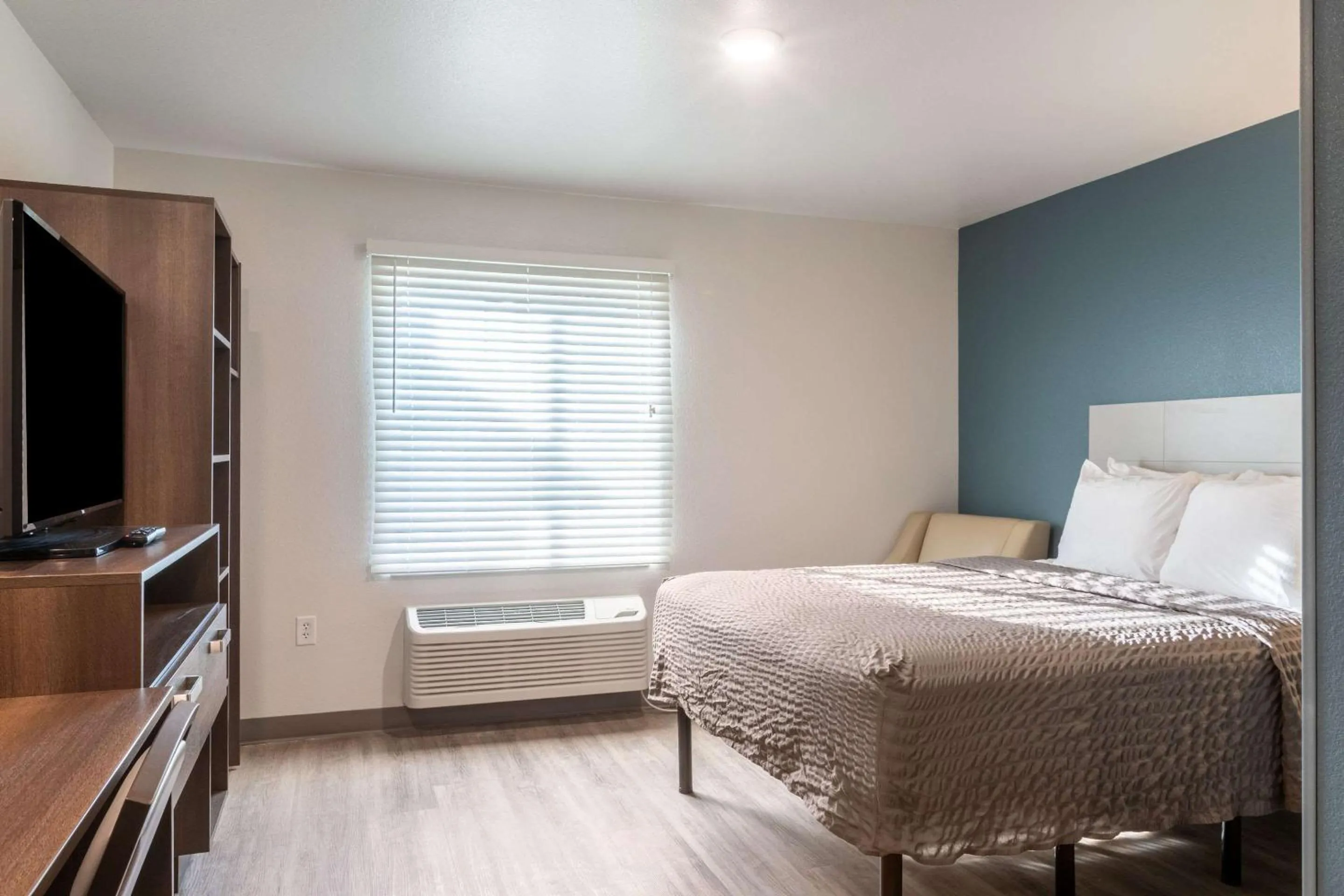 Photo of the whole room, Bed in WoodSpring Suites Atlanta McDonough