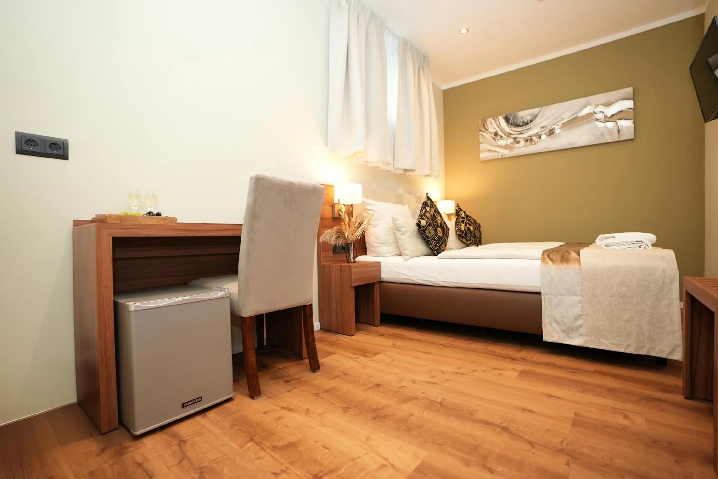 Bed in Hotel Attaché an der Messe