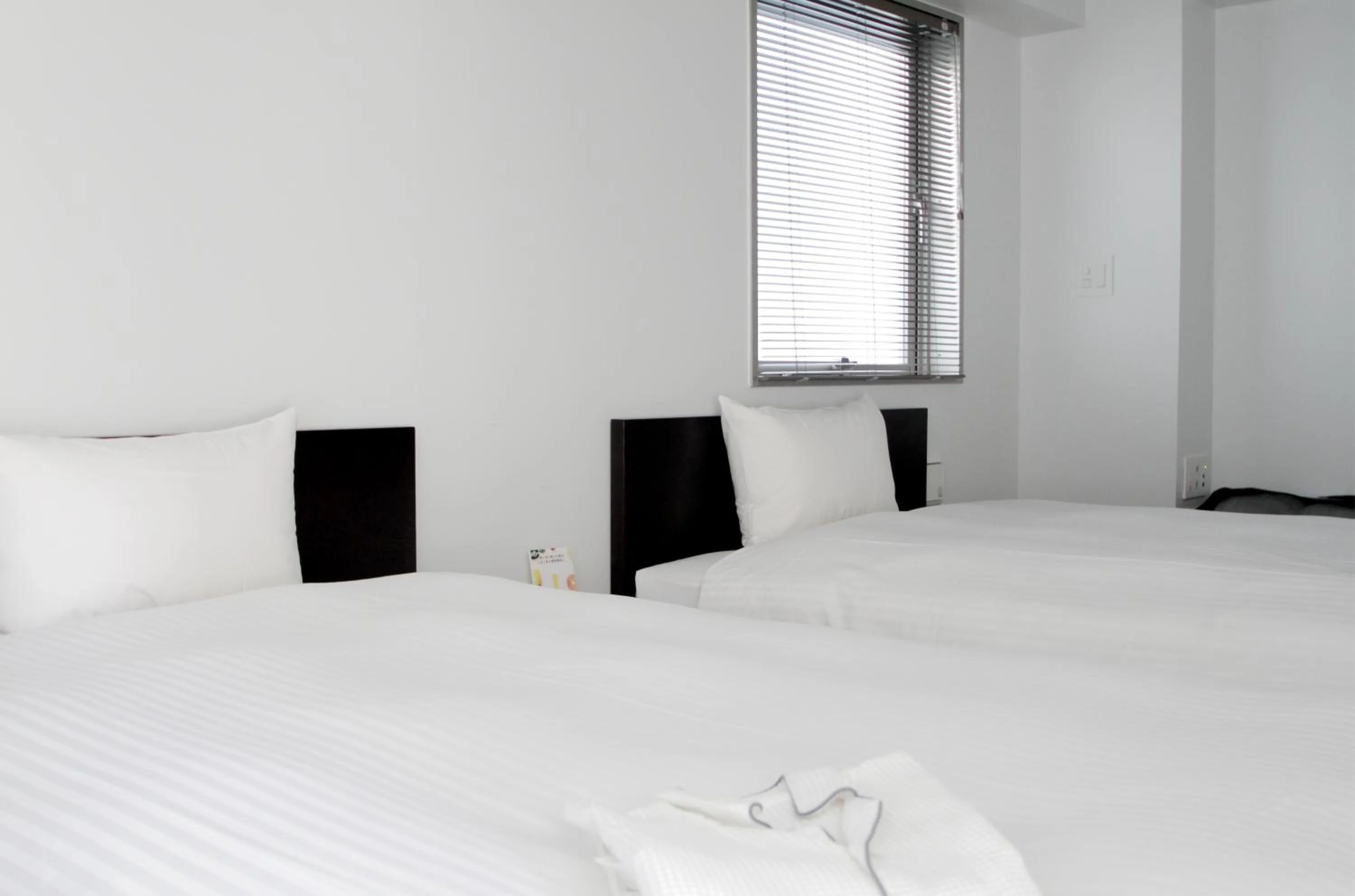 Bed in 8HOTEL Chigasaki