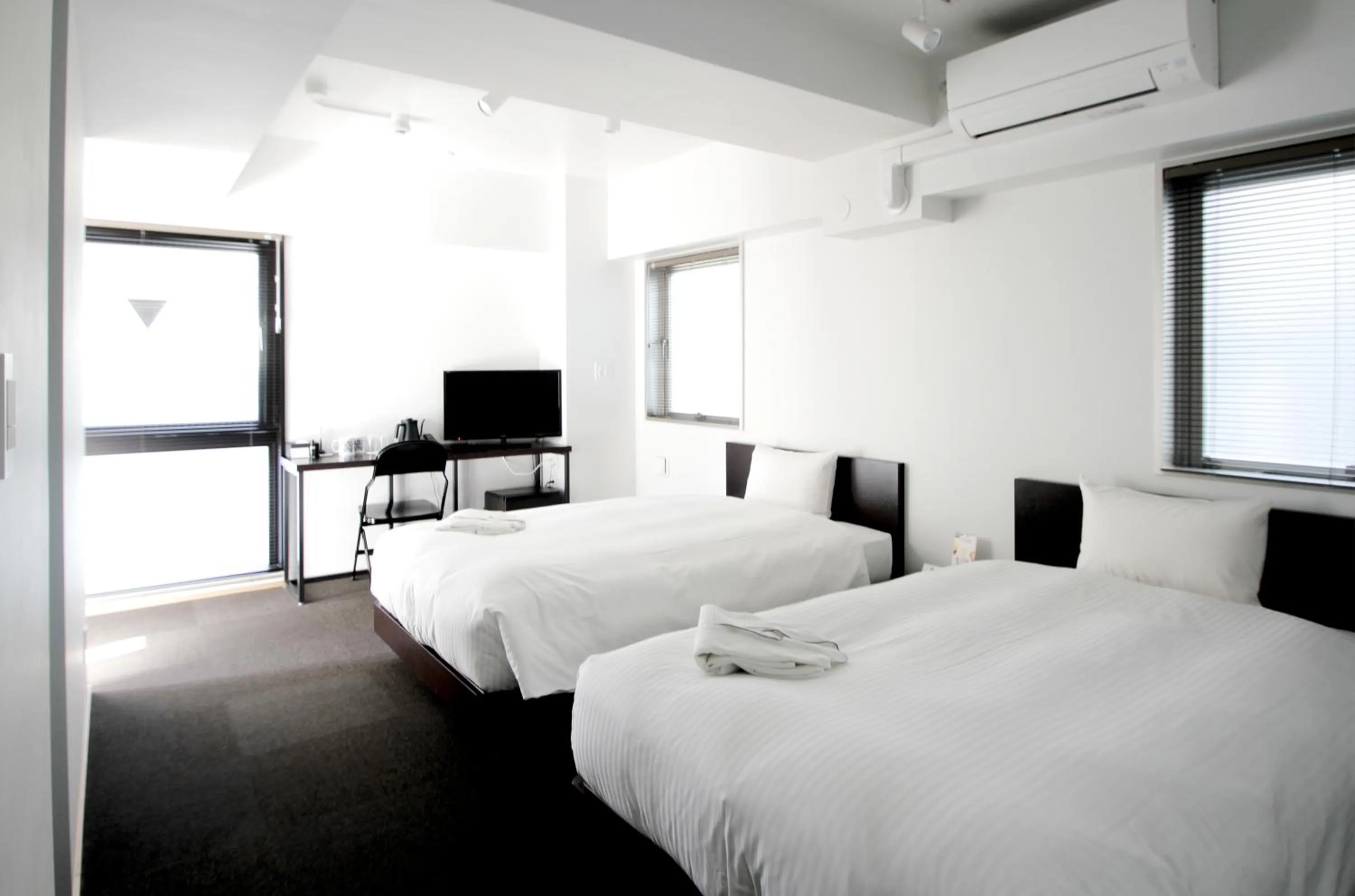 Bed in 8HOTEL Chigasaki