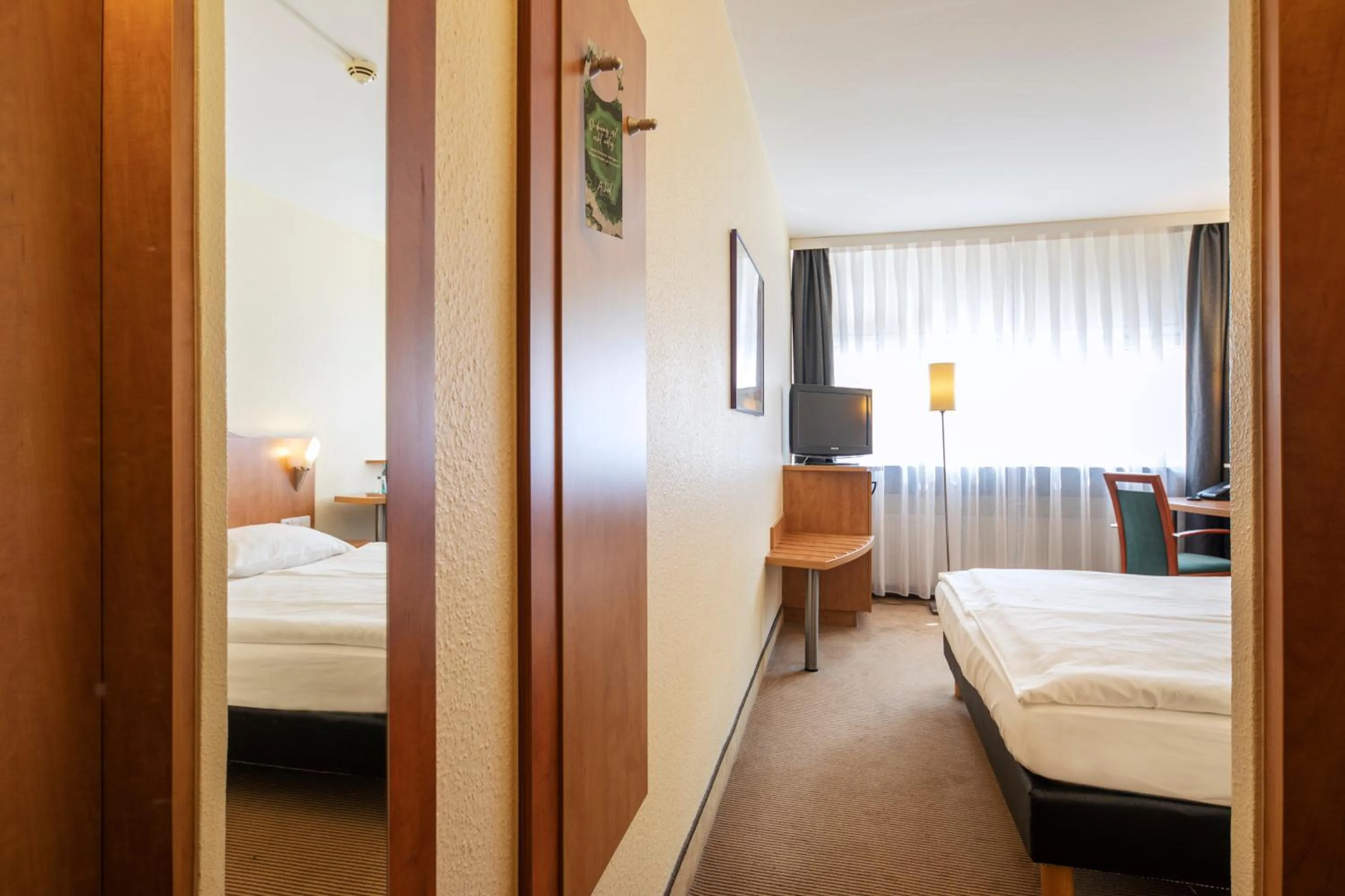 Photo of the whole room, Bed in ACHAT Hotel Braunschweig