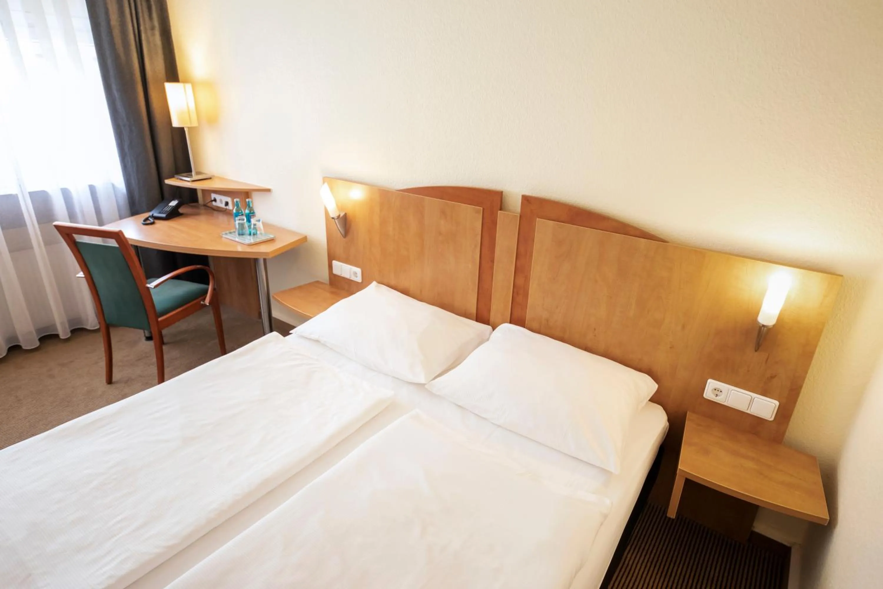 Photo of the whole room, Bed in ACHAT Hotel Braunschweig