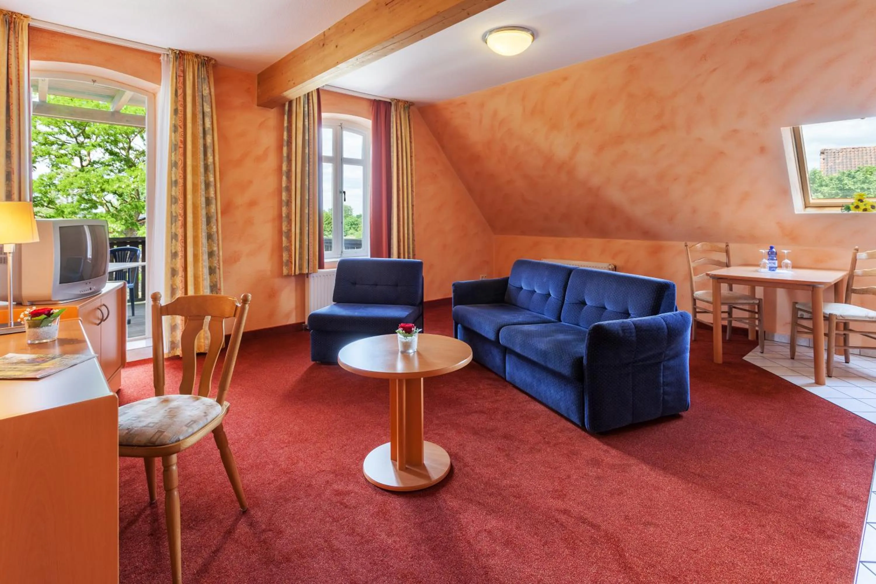Communal lounge/ TV room in Landhotel Zur Linde