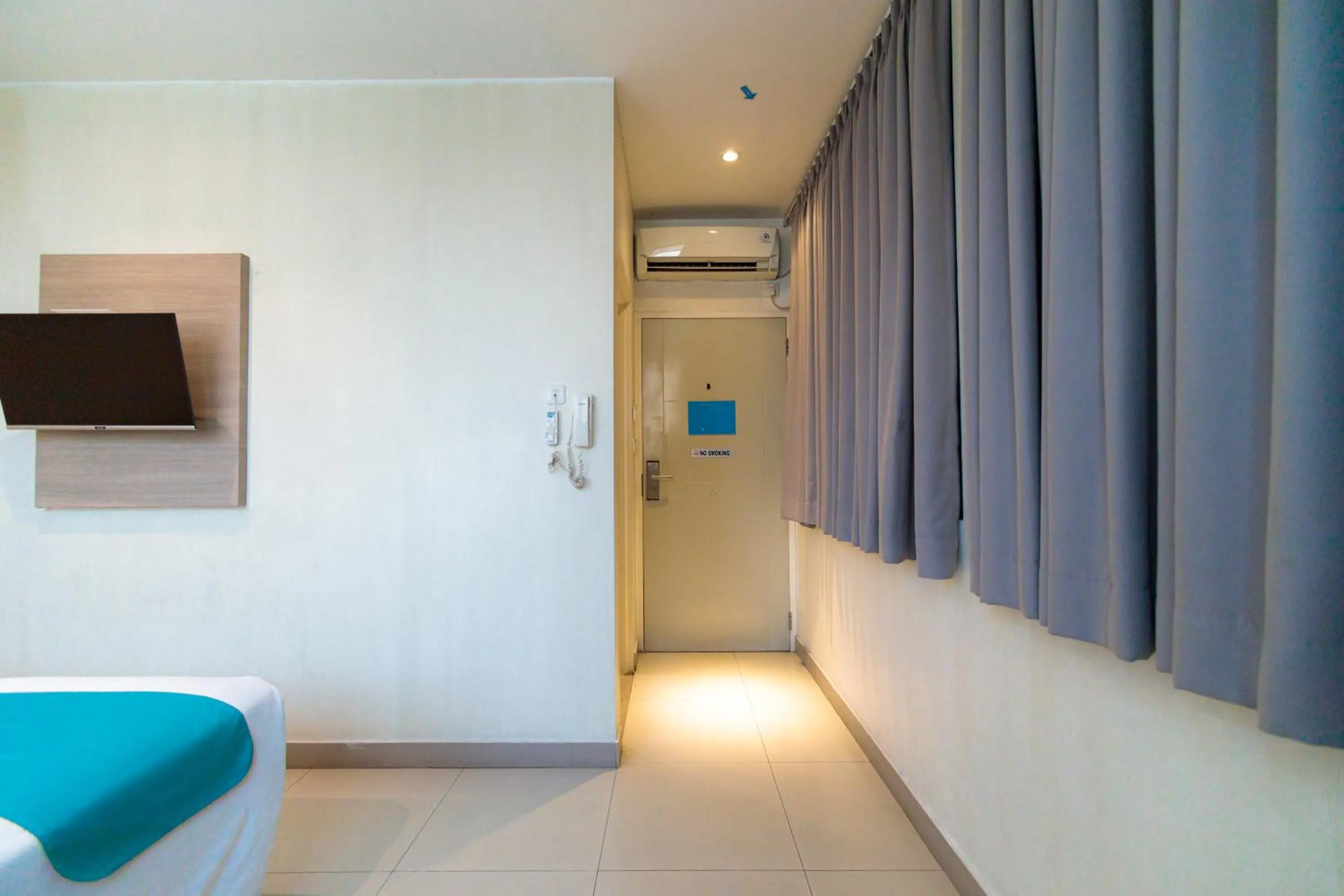 Bedroom in Sans Hotel Liv Ancol by RedDoorz