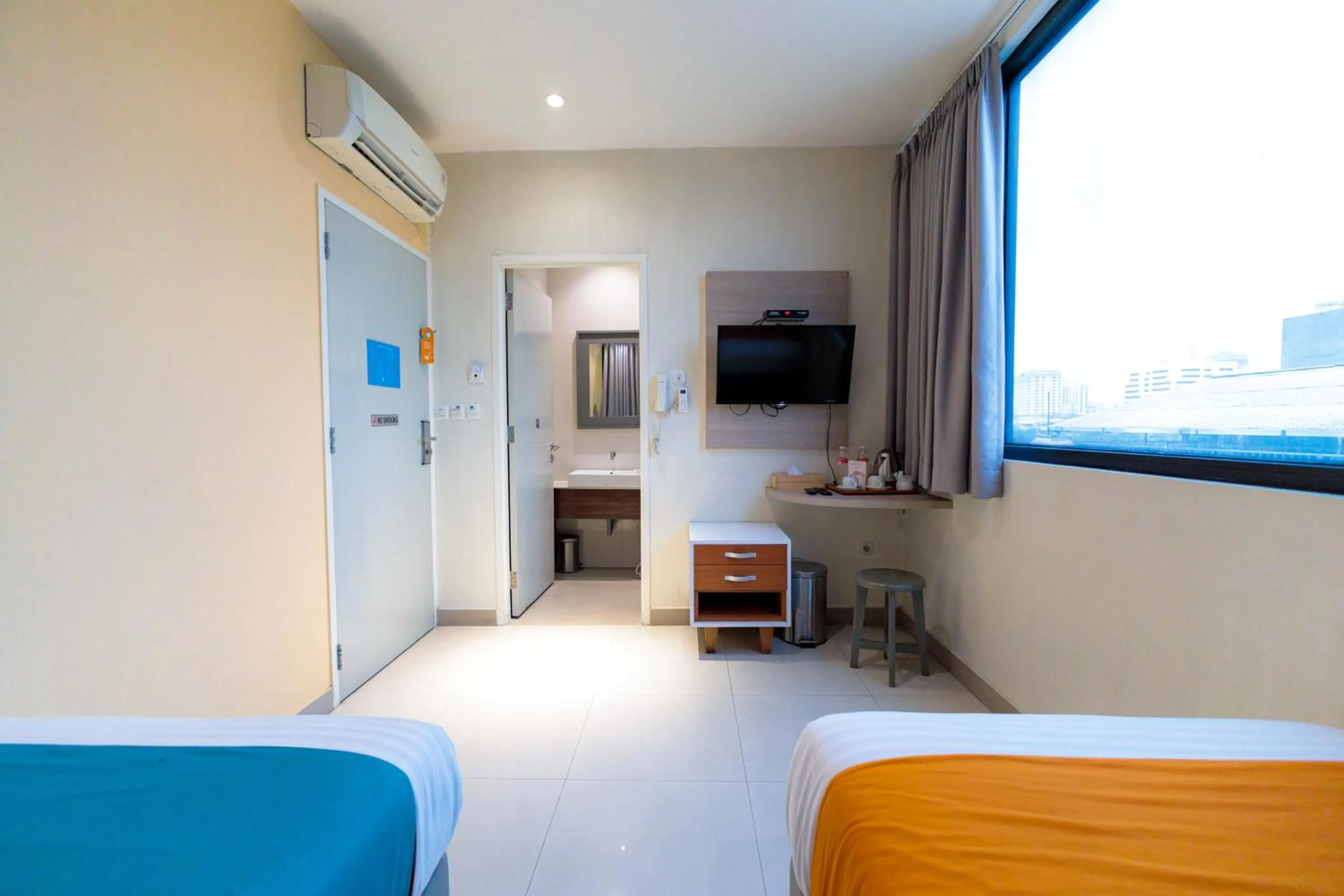Bedroom, Bed in Sans Hotel Liv Ancol by RedDoorz