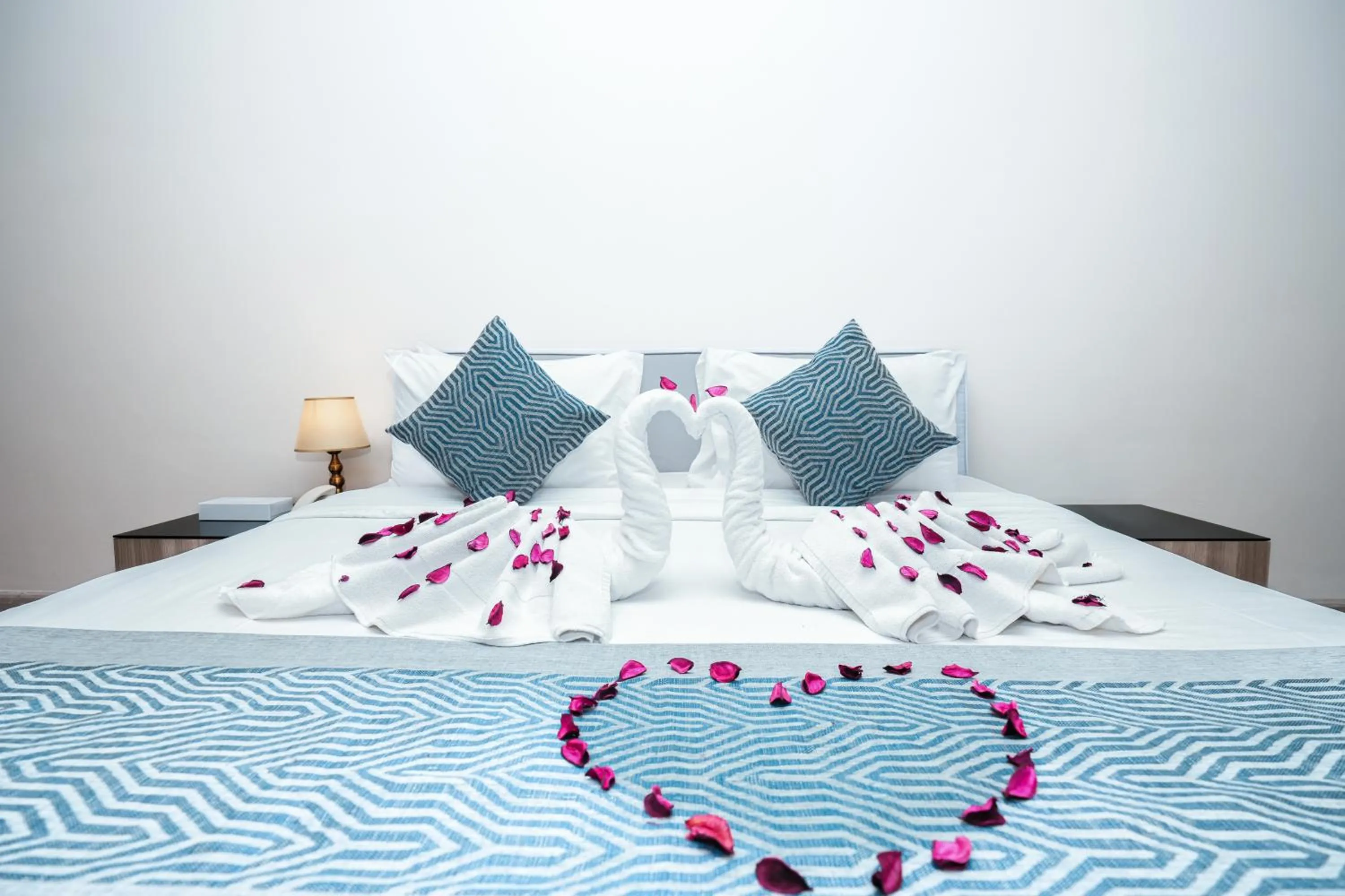 Bed in Eden Garden Hotel Apartment