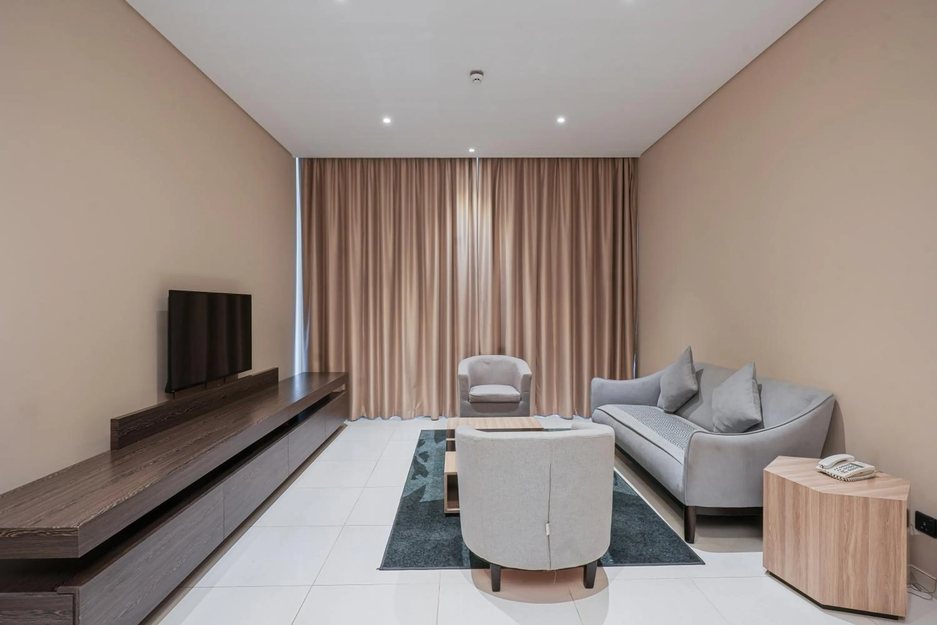 Communal lounge/ TV room in Eden Garden Hotel Apartment