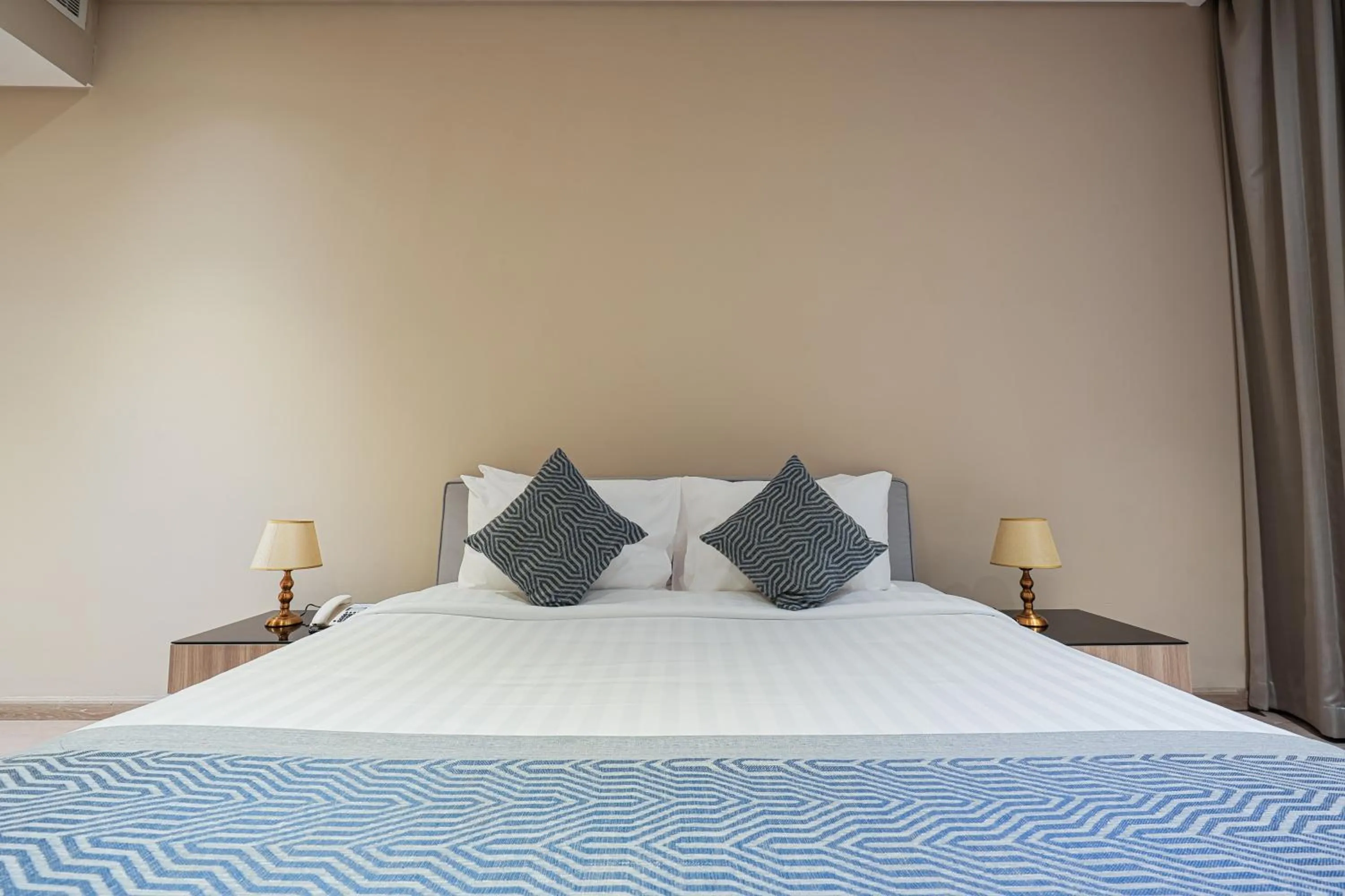 Bed in Eden Garden Hotel Apartment