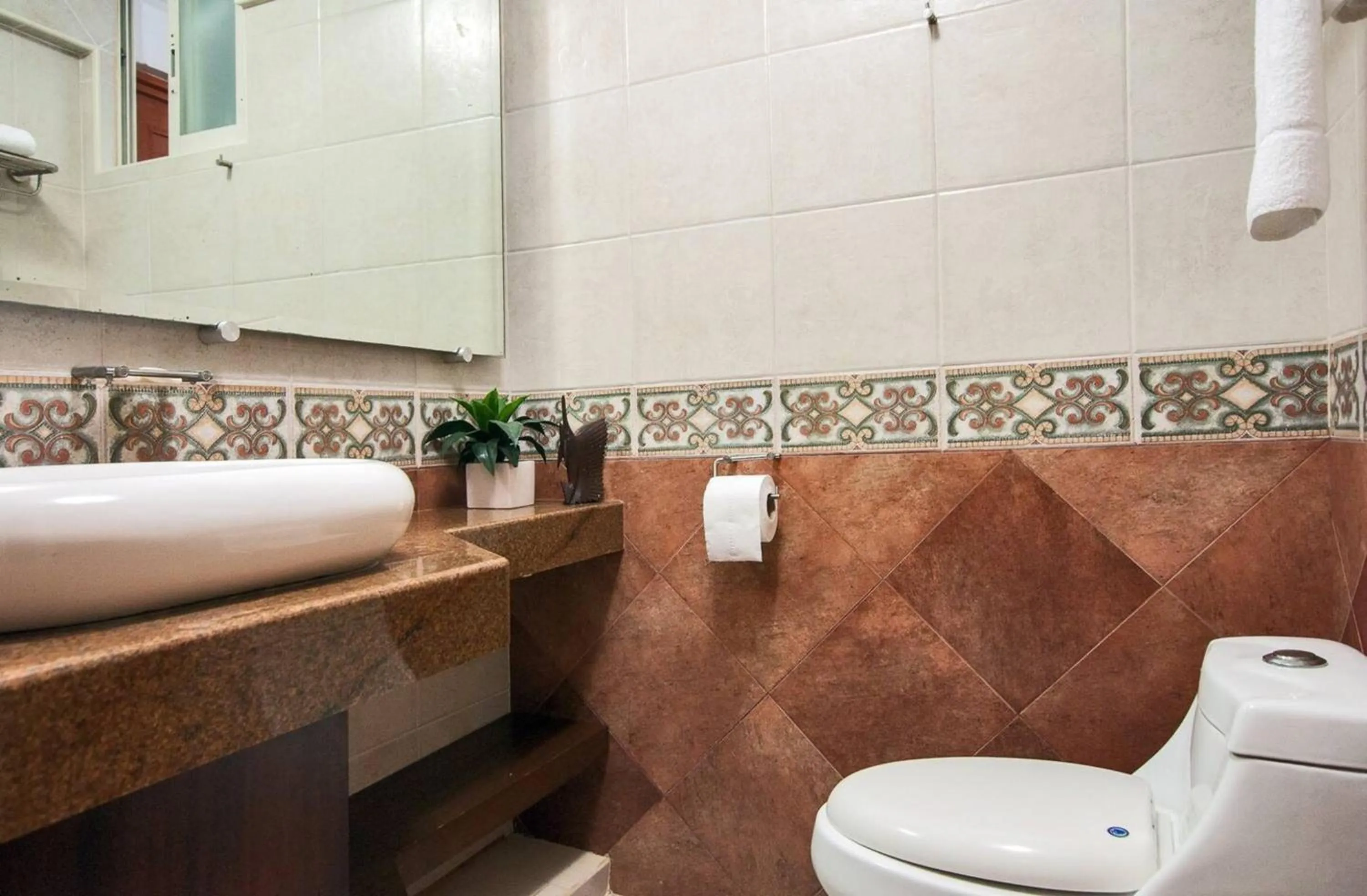 Bathroom in Marina Suites by Andiani Travel