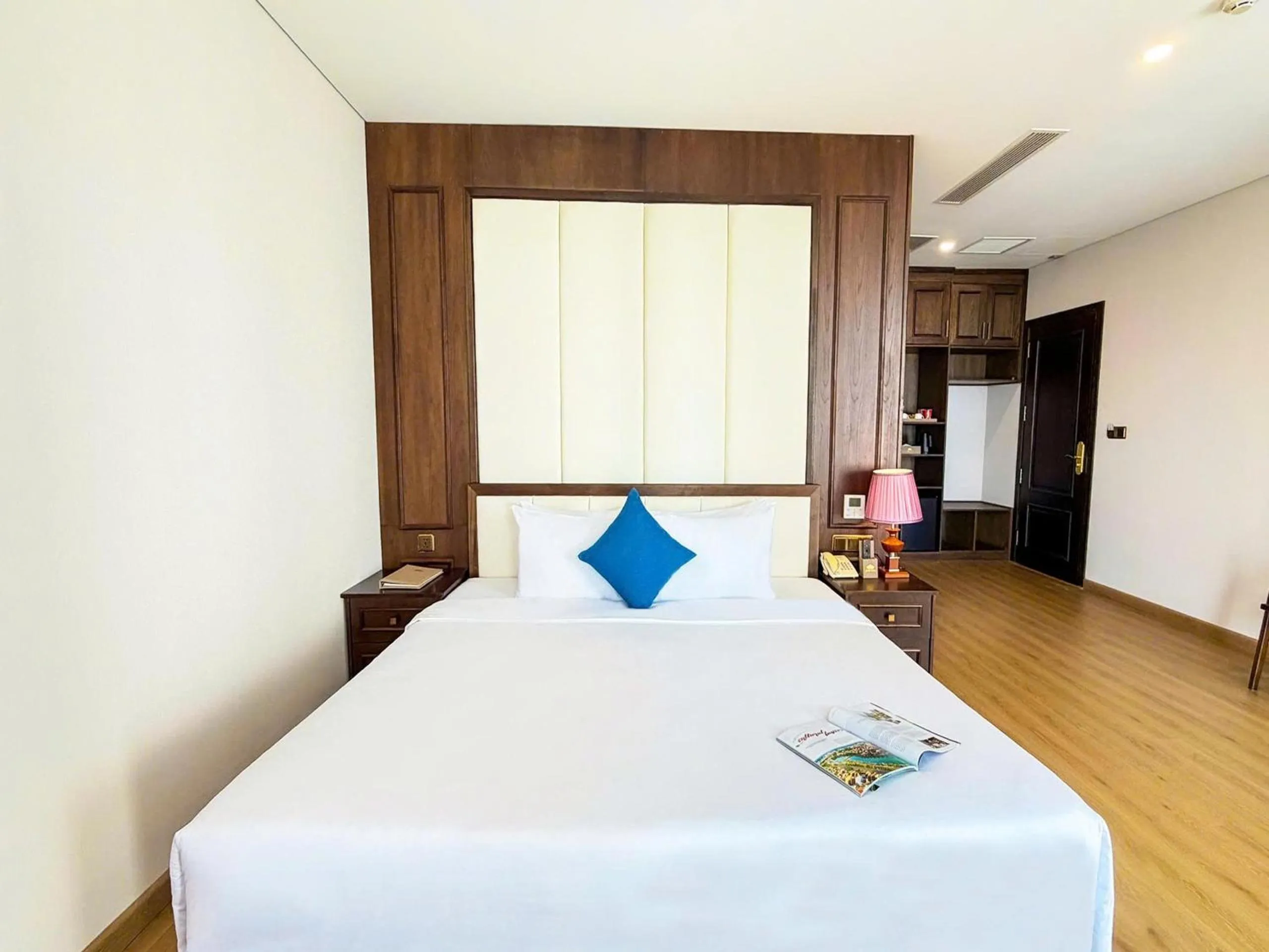 Bed in Golden Lotus Hotel Da Nang - Rooftop Bar Sea View