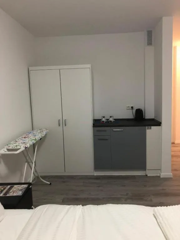 Kitchen or kitchenette, Bed in Apartments am Rheingarten