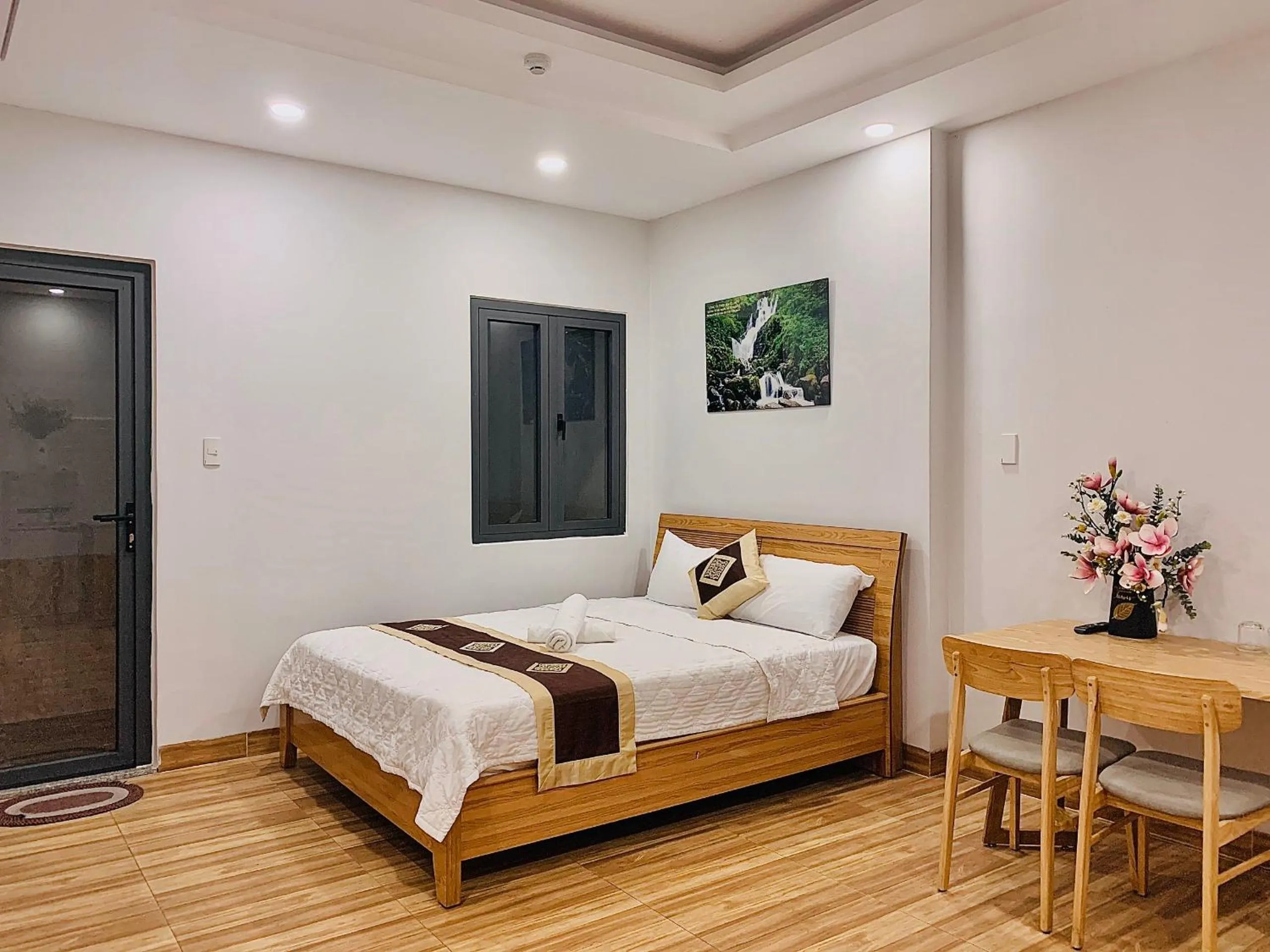 Photo of the whole room, Bed in The Lumiere near Tan Son Nhat Airport