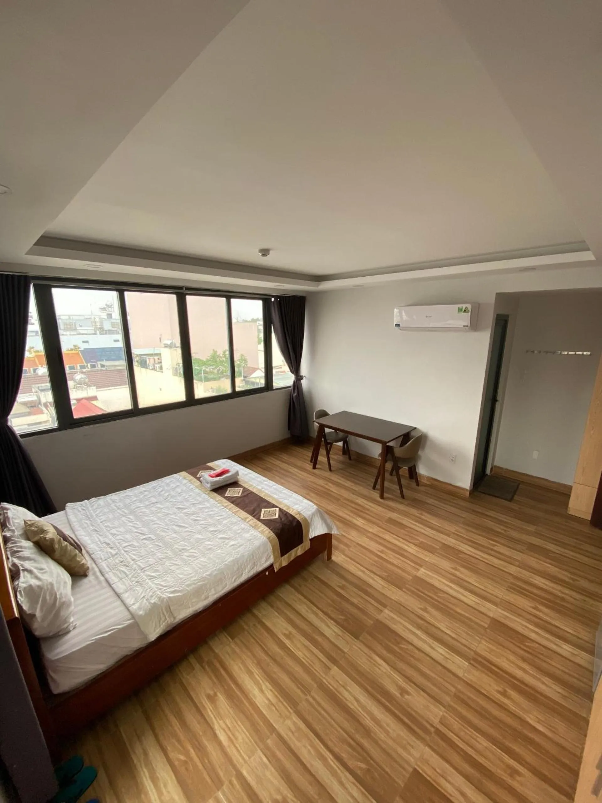 Photo of the whole room, Bed in The Lumiere near Tan Son Nhat Airport