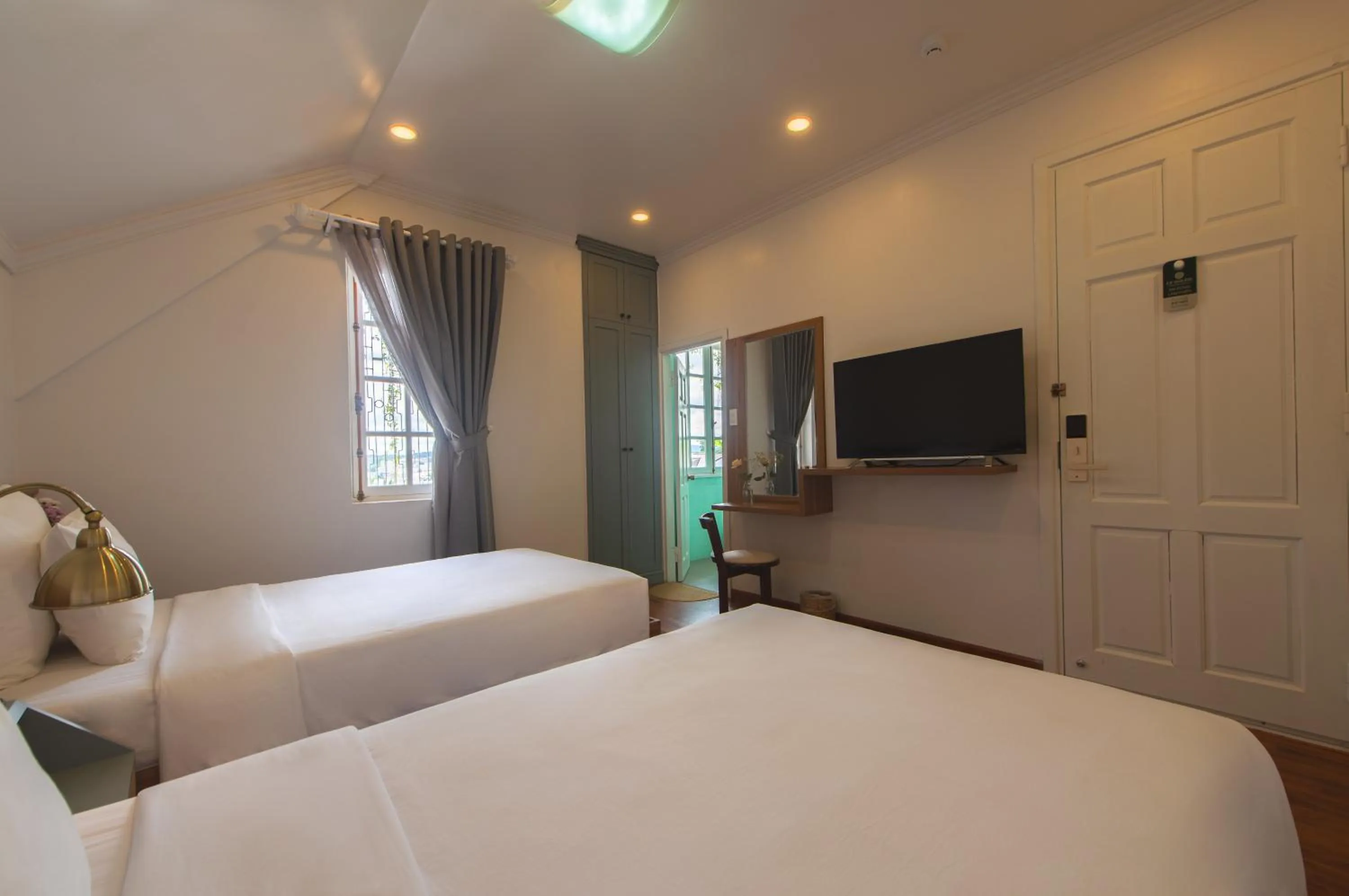 Bed in Le Soleil Boutique Hotel