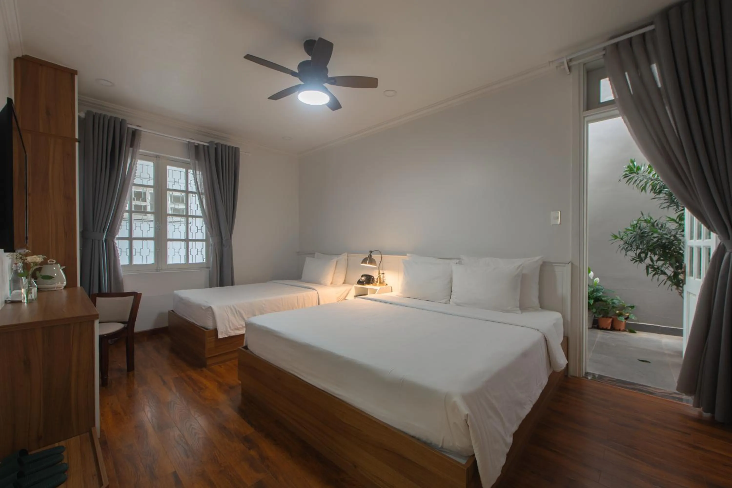 Bed in Le Soleil Boutique Hotel