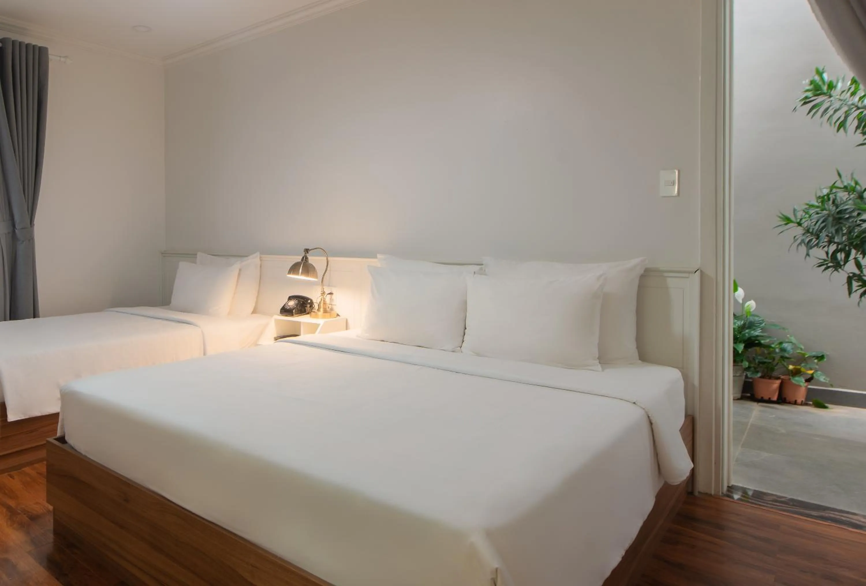 Bed in Le Soleil Boutique Hotel