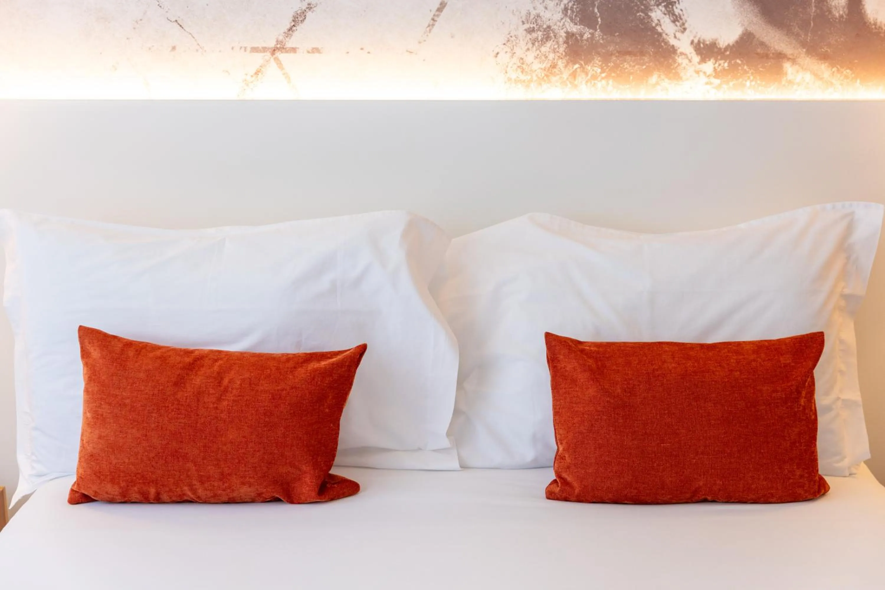 Bed in The ICONS Lisbon Hotel