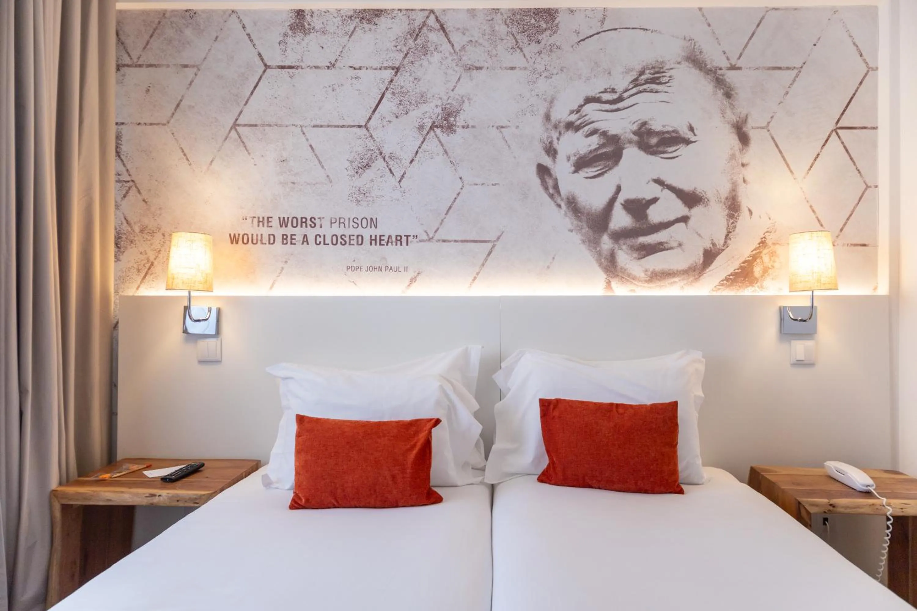 Bed in The ICONS Lisbon Hotel