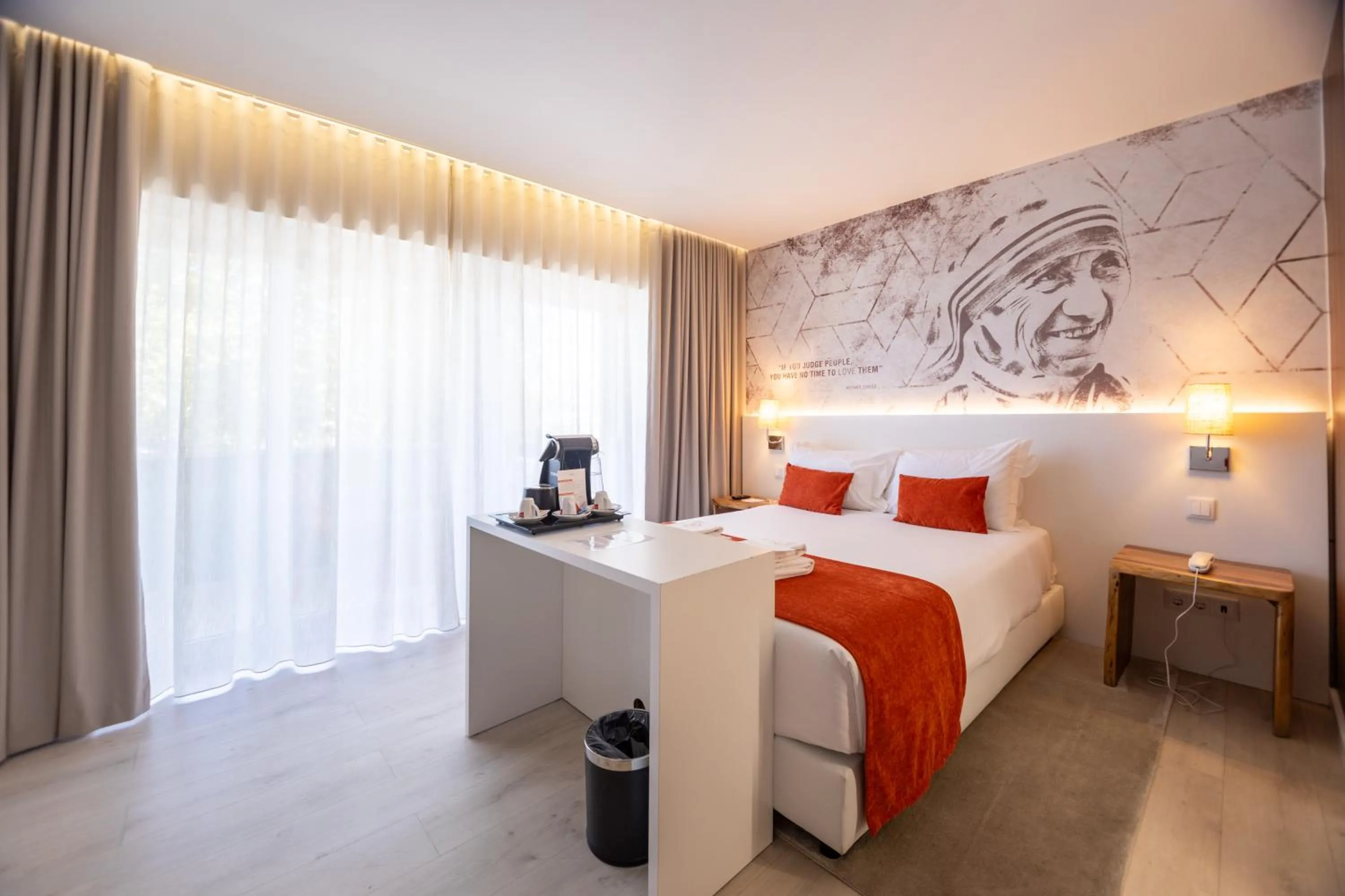 Bed in The ICONS Lisbon Hotel