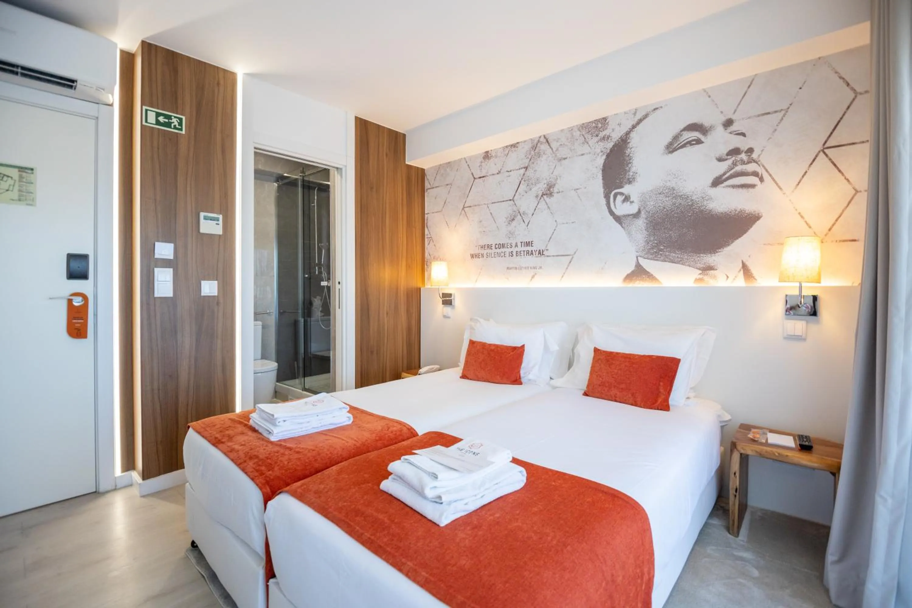 Bed in The ICONS Lisbon Hotel