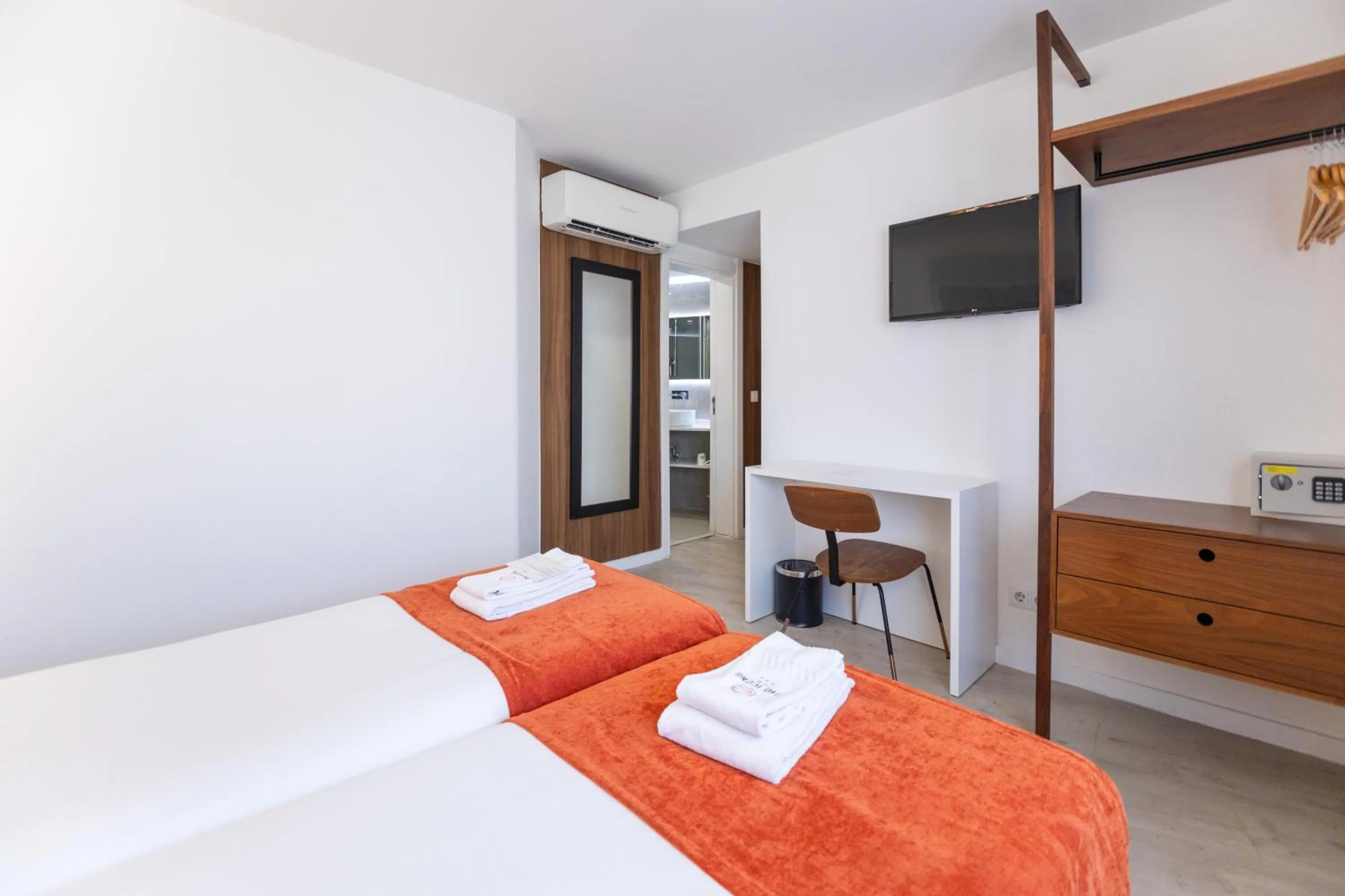 Bed in The ICONS Lisbon Hotel